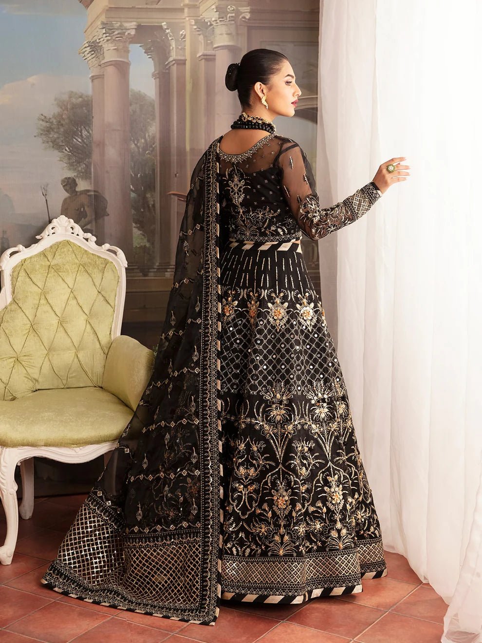 Model wearing a black STELLA GL - LP - V2 - 13 dress from Gulaal's Luxury Pret collection. Discover premium Pakistani clothes online in the UK.