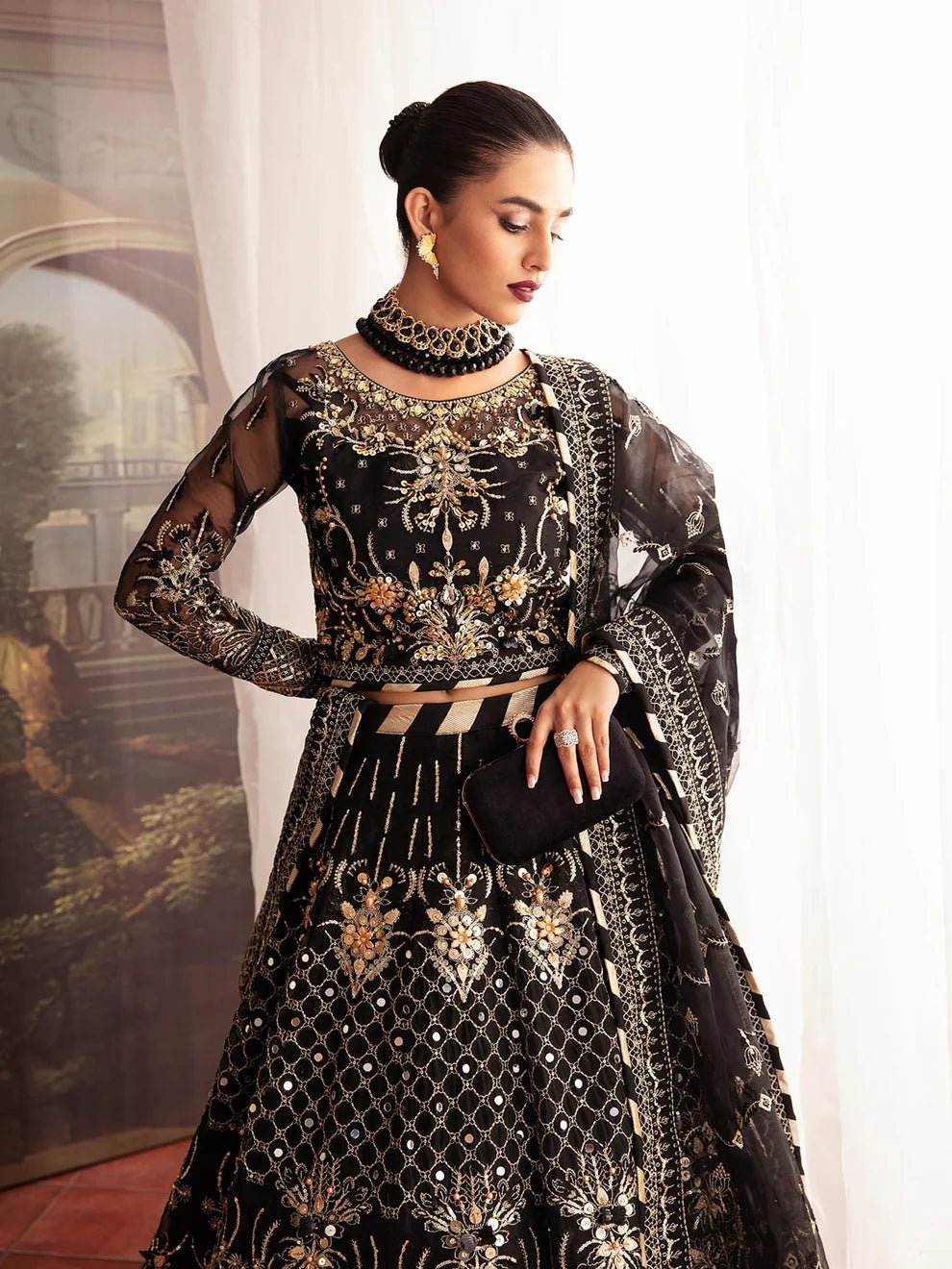 Model wearing a black STELLA GL - LP - V2 - 13 dress from Gulaal's Luxury Pret collection. Discover premium Pakistani clothes online in the UK.