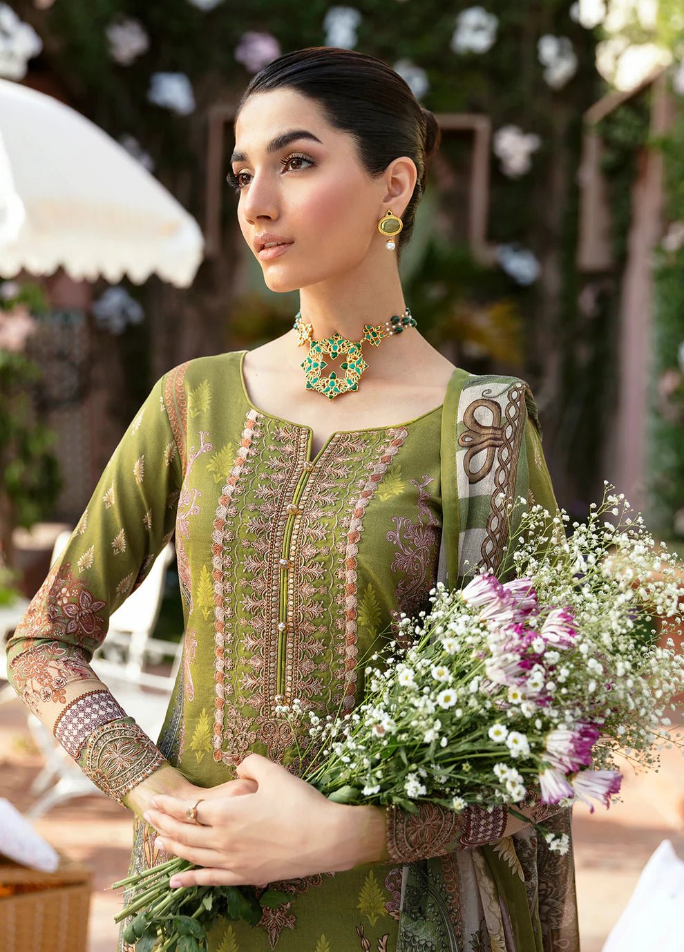 Model wearing the ALICIA olive green dress from Gulaal, perfect for showcasing exquisite Pakistani fashion online in the UK.