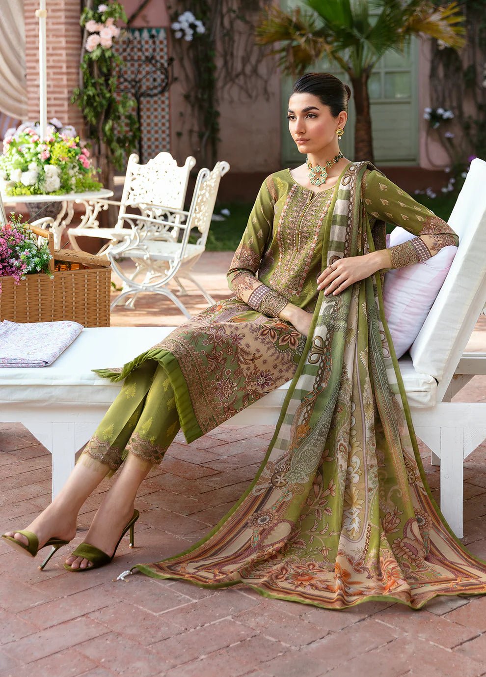 Model wearing the ALICIA olive green dress from Gulaal, perfect for showcasing exquisite Pakistani fashion online in the UK.