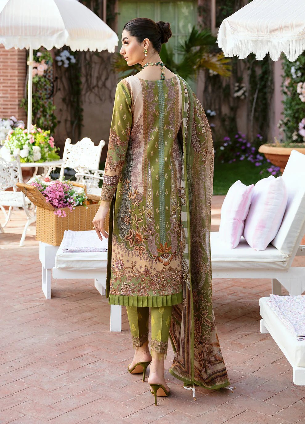 Model wearing the ALICIA olive green dress from Gulaal, perfect for showcasing exquisite Pakistani fashion online in the UK.
