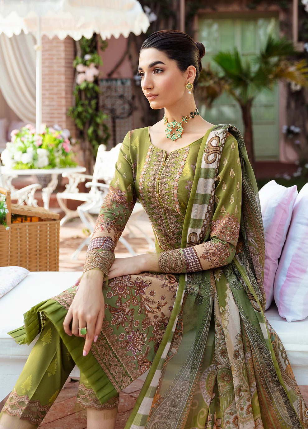 Model wearing the ALICIA olive green dress from Gulaal, perfect for showcasing exquisite Pakistani fashion online in the UK.