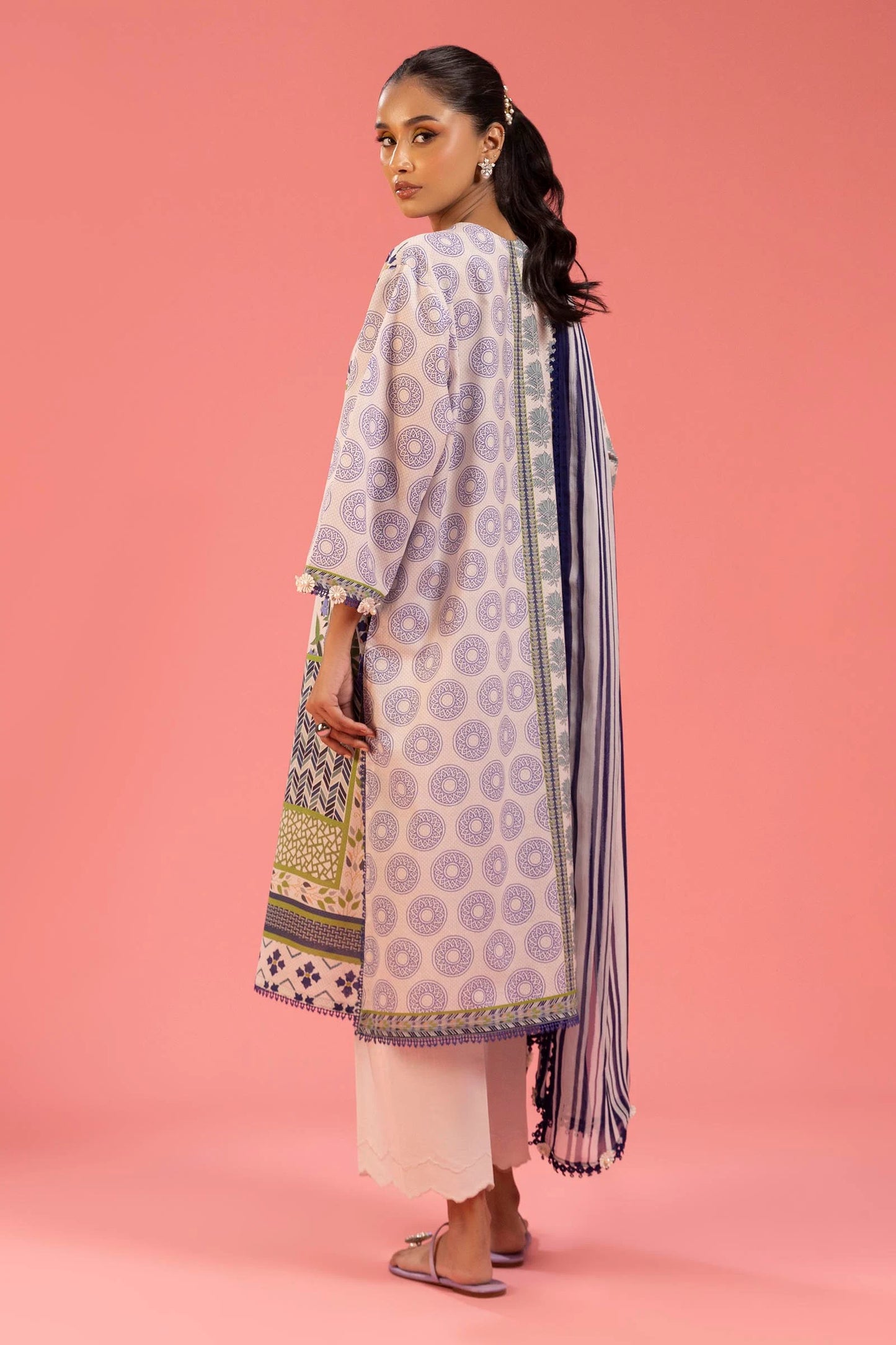 Model wearing multicolour green, purple, and cream printed outfit from Sana Safinaz, Mahay Spring '25, Pakistani clothes online in UK.