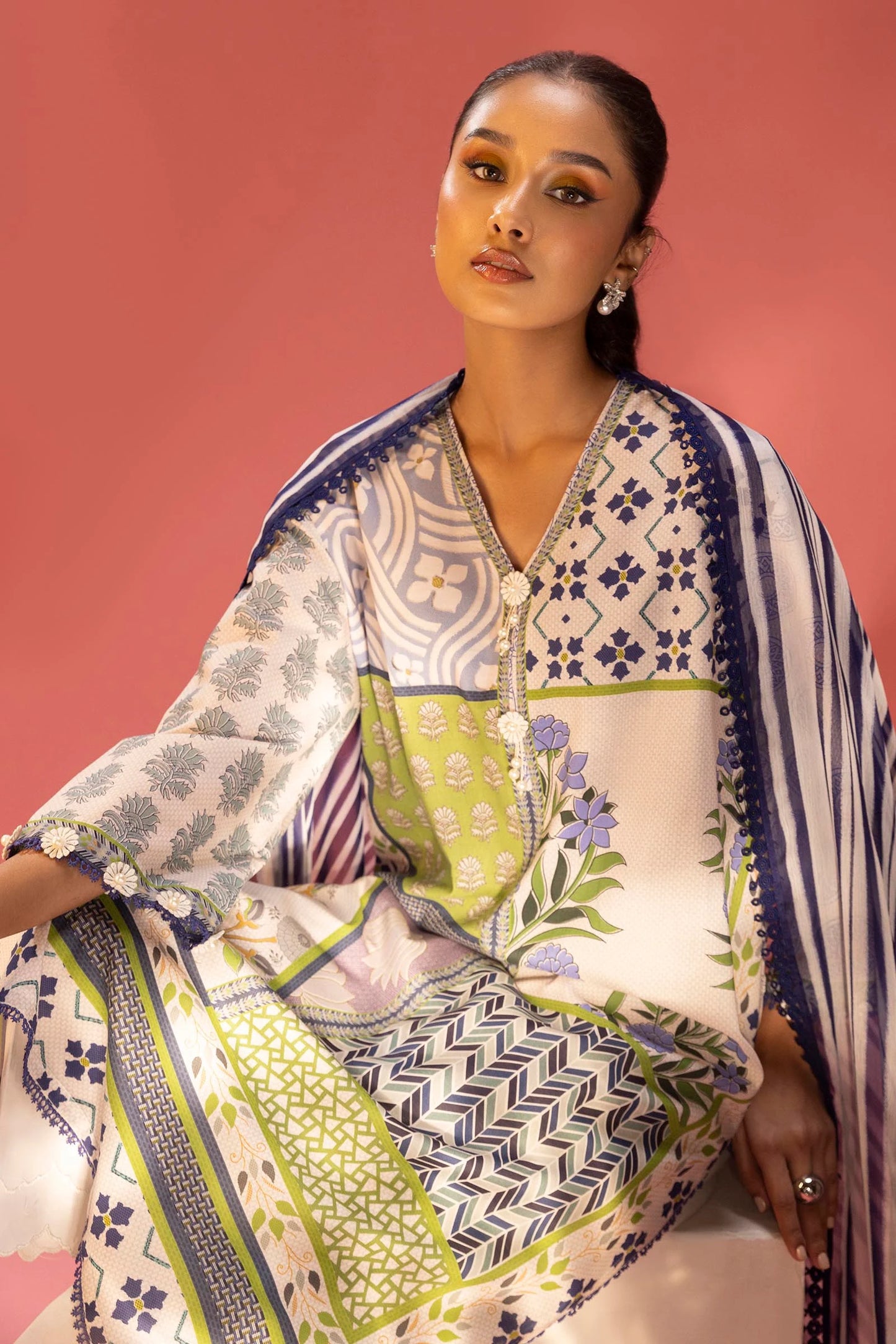 Model wearing multicolour green, purple, and cream printed outfit from Sana Safinaz, Mahay Spring '25, Pakistani clothes online in UK.