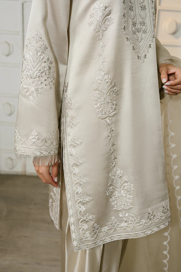 Model wearing ivory ELIYA-SREP1-01 from Saira Rizwan Luxury Lawn Eid Edit '25, perfect Pakistani luxury pret for UK desi fashion lovers.
