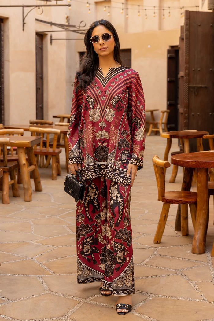 Model wearing maroon co-ord set with beige and black floral print from Saira Rizwan, Pakistani Luxury pret, Pakistani clothes online in UK.