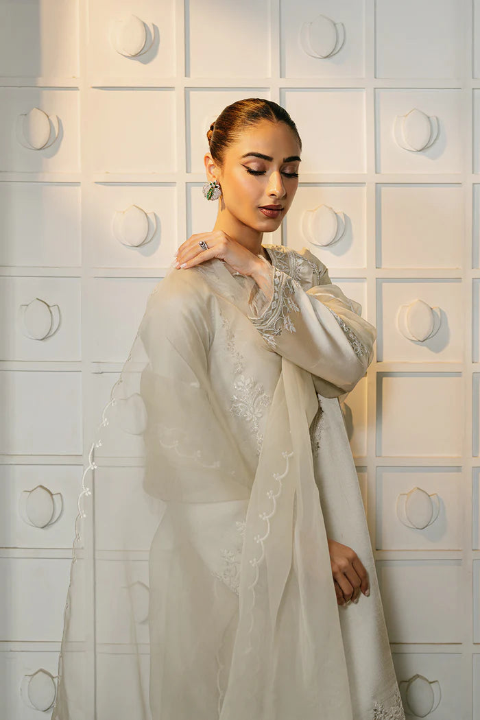 Model wearing ivory ELIYA-SREP1-01 from Saira Rizwan Luxury Lawn Eid Edit '25, perfect Pakistani luxury pret for UK desi fashion lovers.