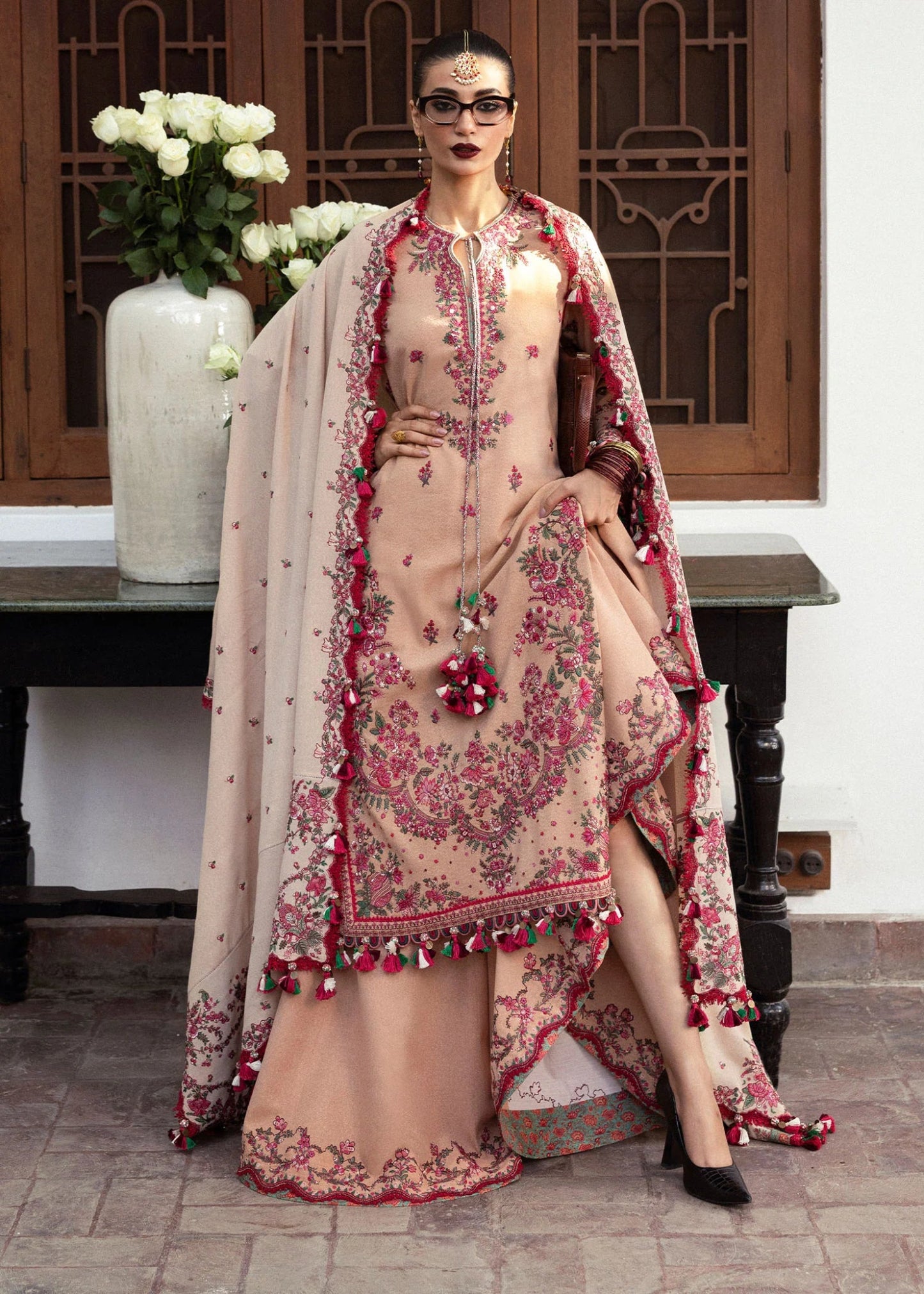 Model wearing Lali from Hussain Rehar's Karandi AW '24, showcasing luxury Pakistani clothes online in UK.