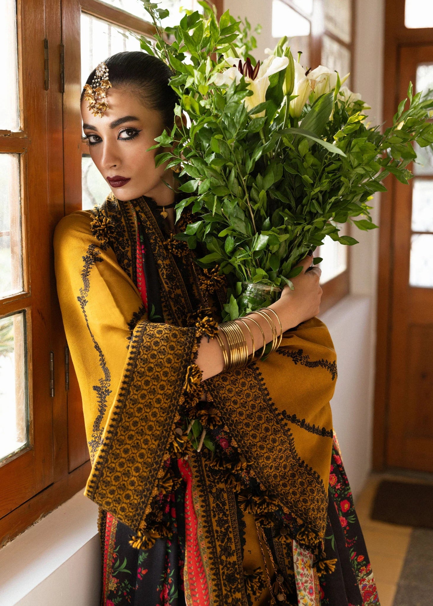 Model wearing Saage from Hussain Rehar's Karandi AW '24, showcasing luxury Pakistani clothes online in UK.