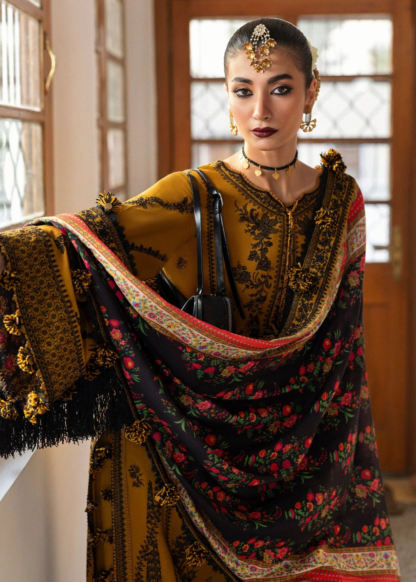 Model wearing Saage from Hussain Rehar's Karandi AW '24, showcasing luxury Pakistani clothes online in UK.