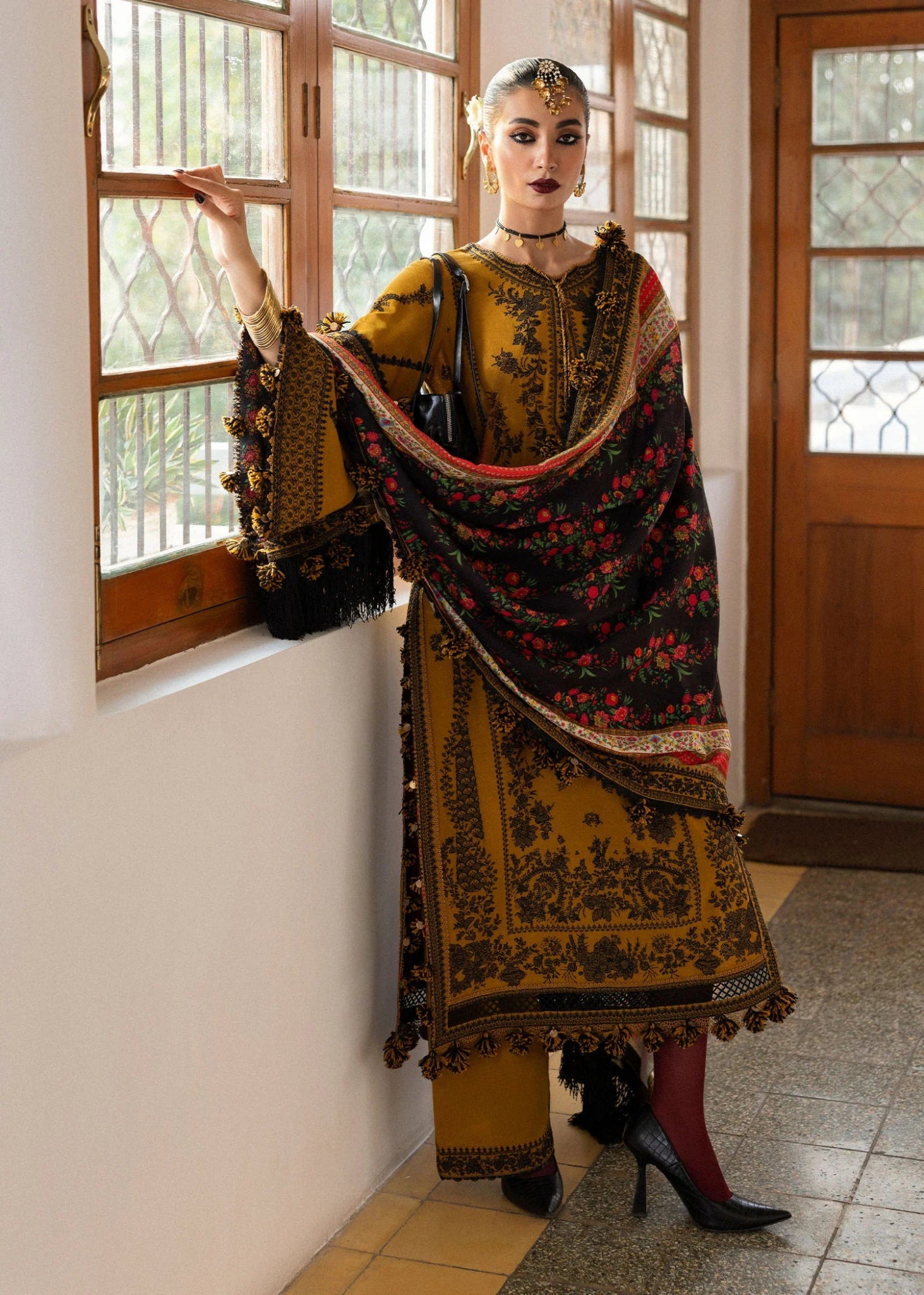 Model wearing Saage from Hussain Rehar's Karandi AW '24, showcasing luxury Pakistani clothes online in UK.