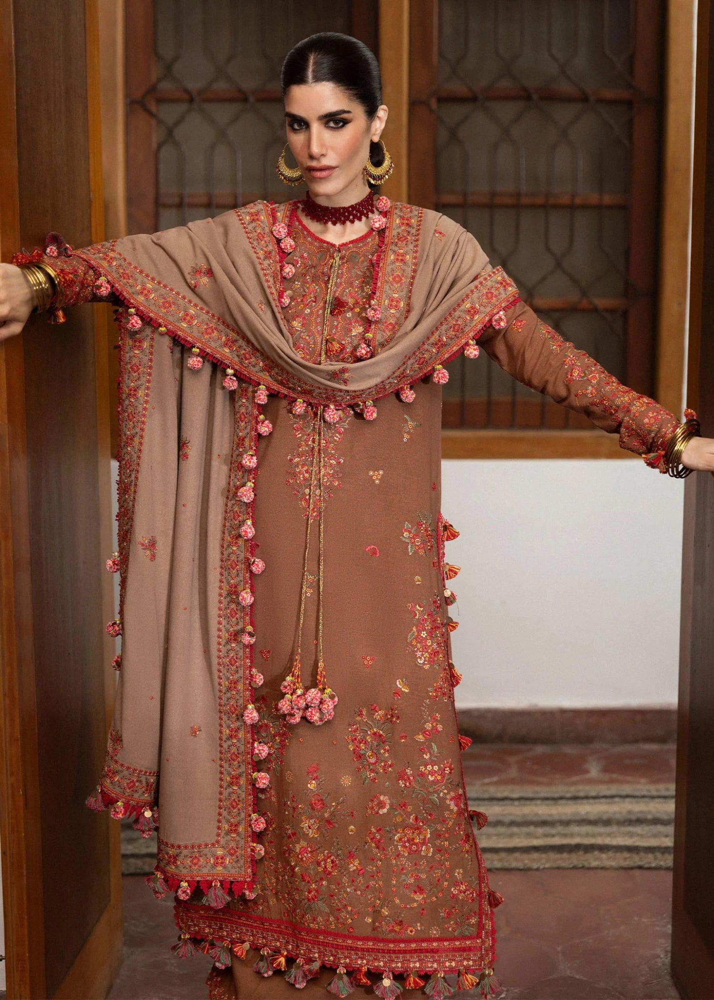 Model wearing Shay from Hussain Rehar's Karandi AW '24, showcasing luxury Pakistani clothes online in UK.