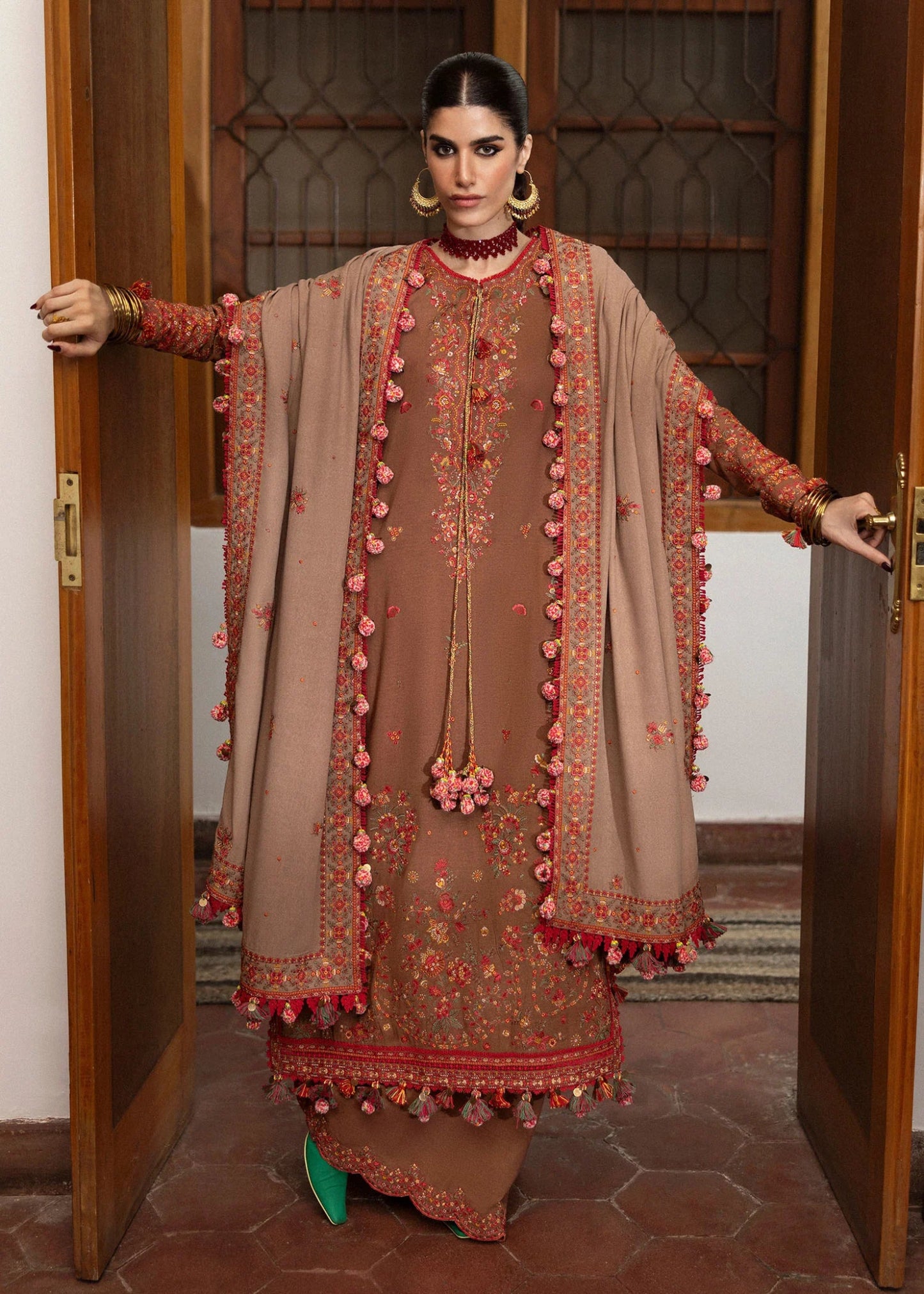 Model wearing Shay from Hussain Rehar's Karandi AW '24, showcasing luxury Pakistani clothes online in UK.