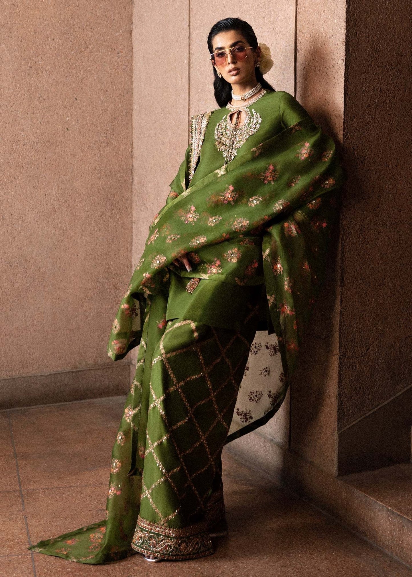 Model wearing an elegant green Celeine dress from Hussain Rehar's Luxury Pret Eid '24 collection. Pakistani clothes online in UK.