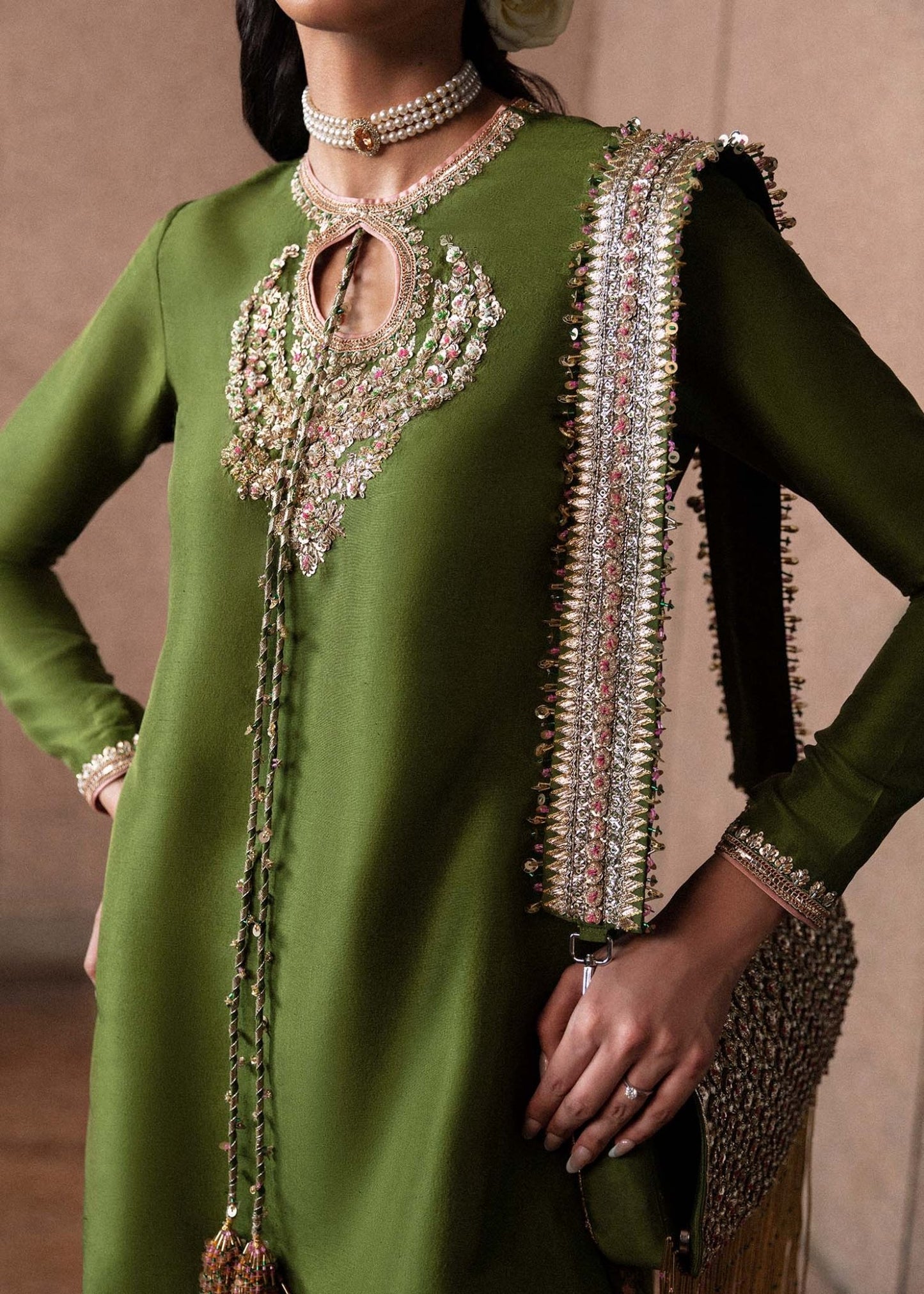 Model wearing an elegant green Celeine dress from Hussain Rehar's Luxury Pret Eid '24 collection. Pakistani clothes online in UK.