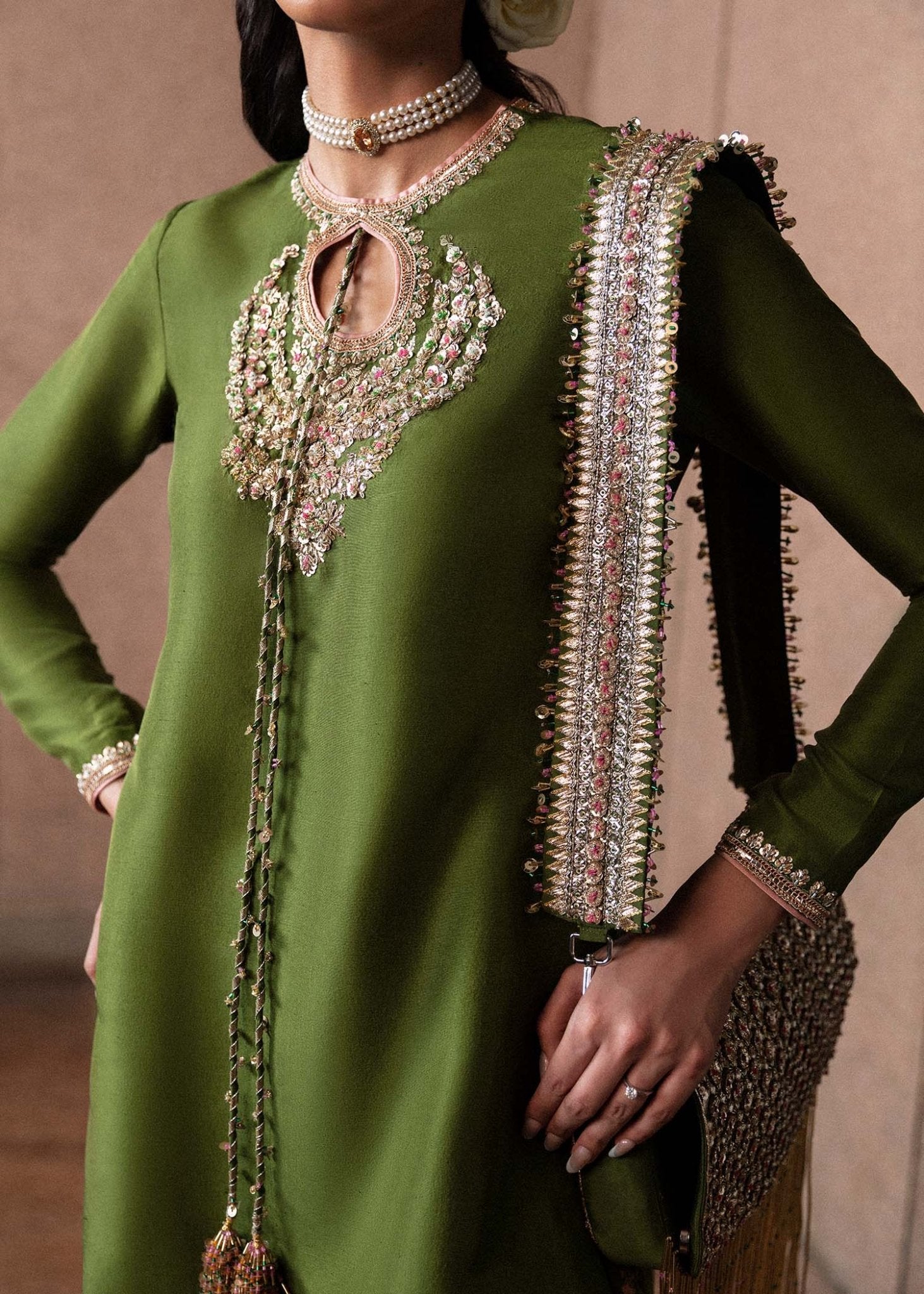 Model wearing an elegant green Celeine dress from Hussain Rehar's Luxury Pret Eid '24 collection. Pakistani clothes online in UK.