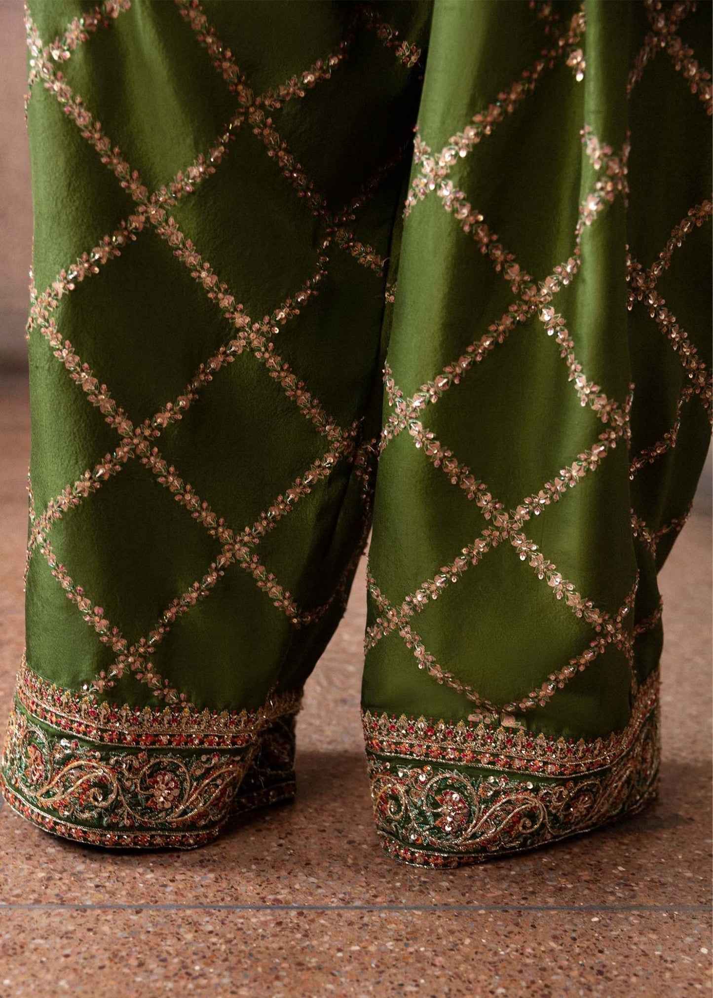 Model wearing an elegant green Celeine dress from Hussain Rehar's Luxury Pret Eid '24 collection. Pakistani clothes online in UK.