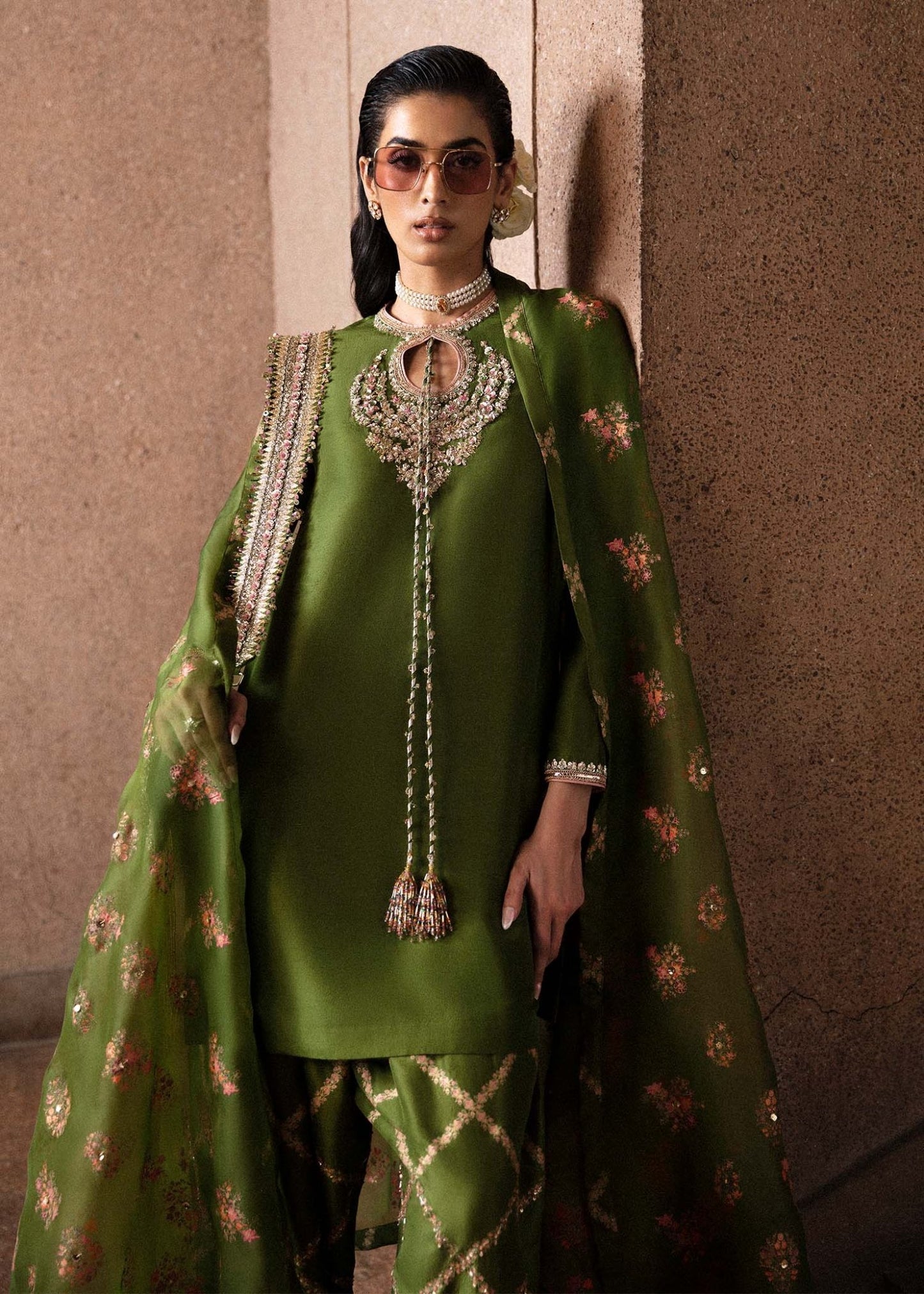 Model wearing an elegant green Celeine dress from Hussain Rehar's Luxury Pret Eid '24 collection. Pakistani clothes online in UK.