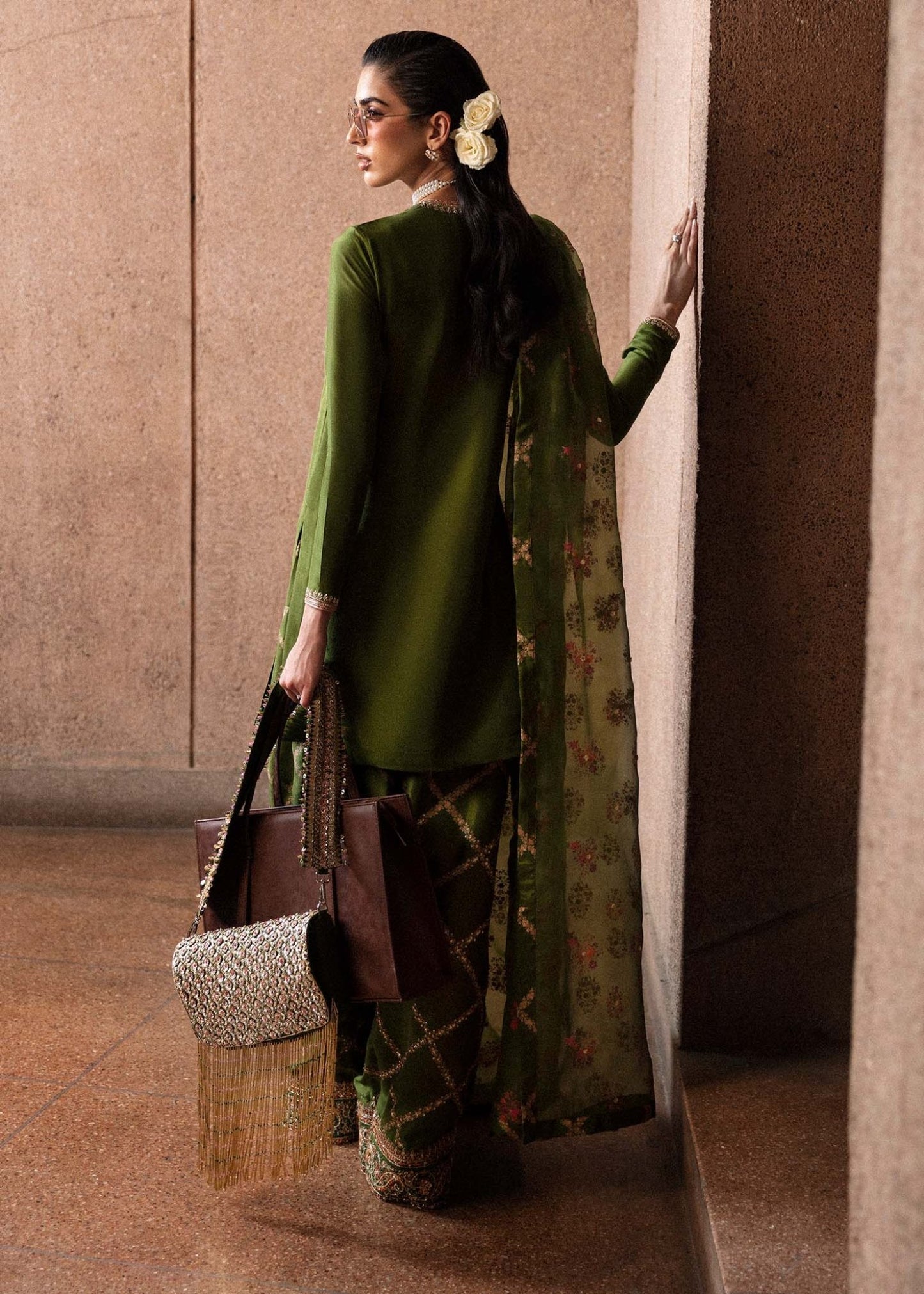 Model wearing an elegant green Celeine dress from Hussain Rehar's Luxury Pret Eid '24 collection. Pakistani clothes online in UK.