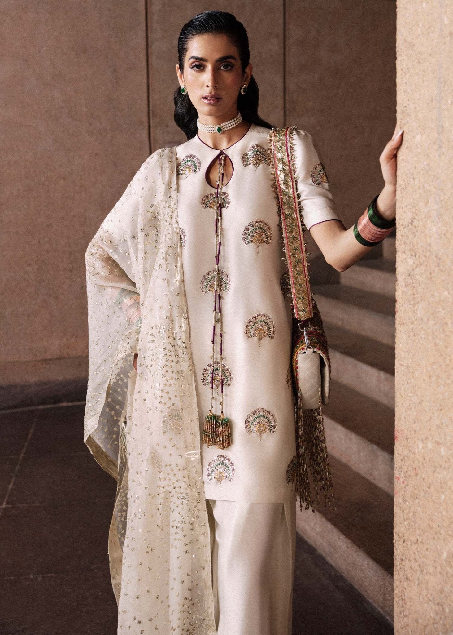 Model wearing an elegant white Lin dress from Hussain Rehar's Luxury Pret Eid '24 collection. Pakistani clothes online in UK.