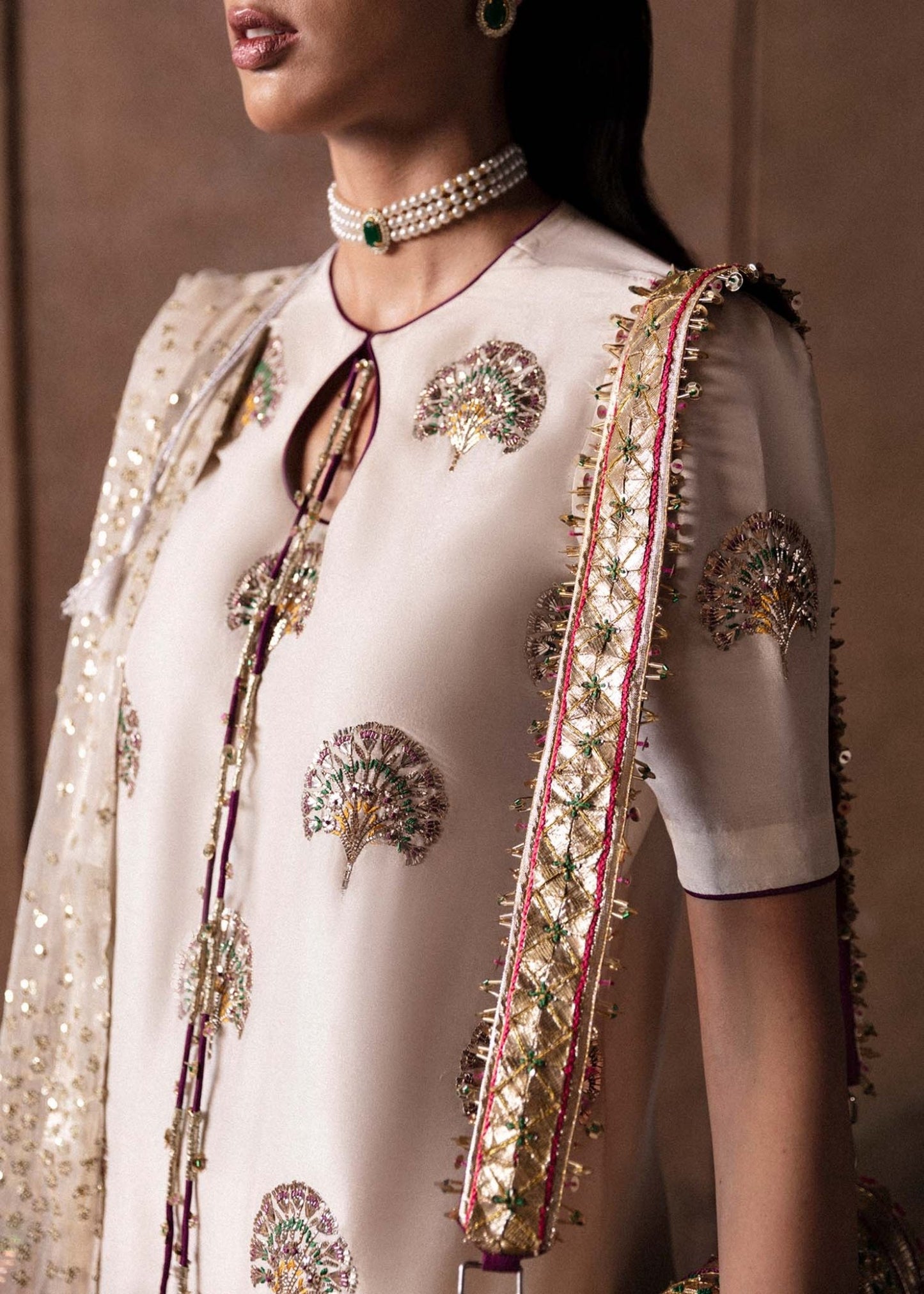 Model wearing an elegant white Lin dress from Hussain Rehar's Luxury Pret Eid '24 collection. Pakistani clothes online in UK.