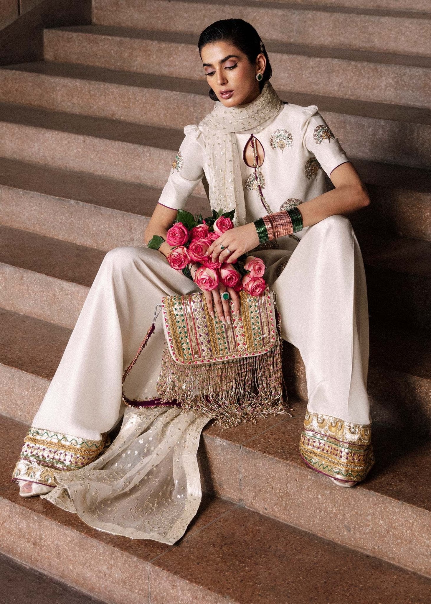 Model wearing an elegant white Lin dress from Hussain Rehar's Luxury Pret Eid '24 collection. Pakistani clothes online in UK.