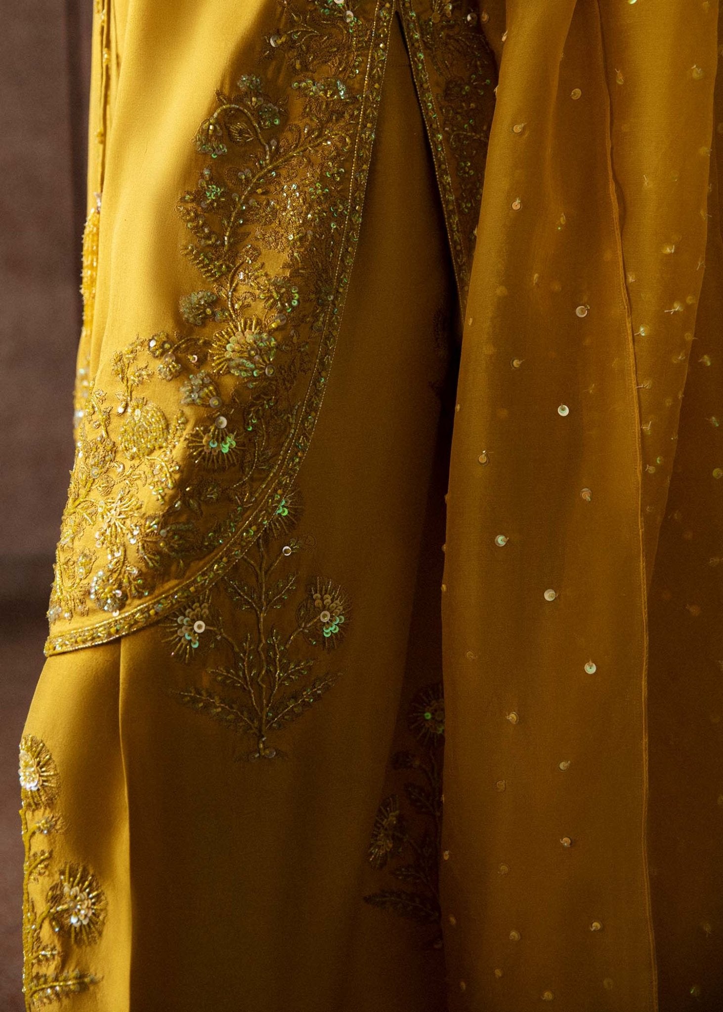 Model wearing a vibrant yellow Maize dress from Hussain Rehar's Luxury Pret Eid '24 collection. Pakistani clothes online in UK.