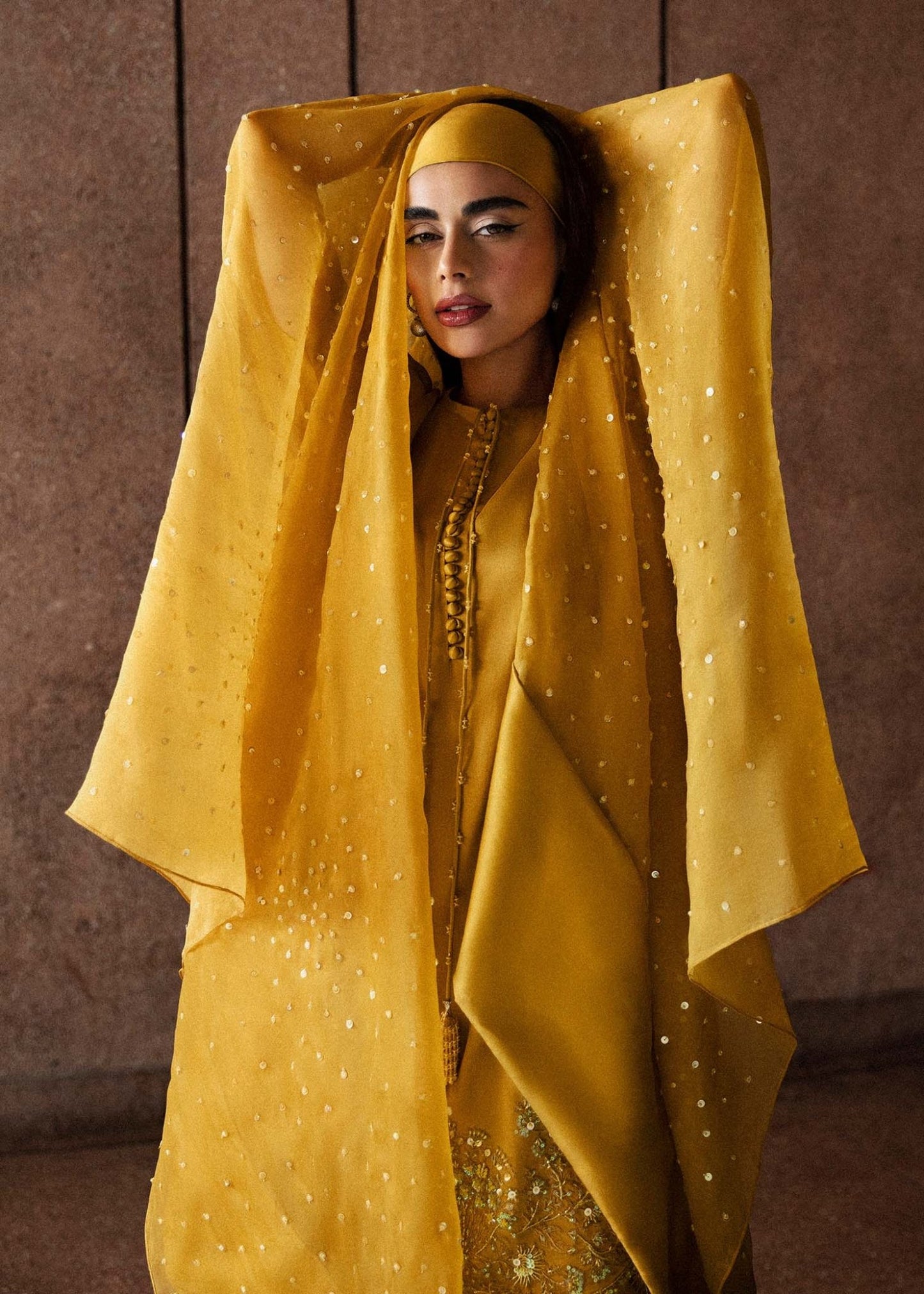 Model wearing a vibrant yellow Maize dress from Hussain Rehar's Luxury Pret Eid '24 collection. Pakistani clothes online in UK.