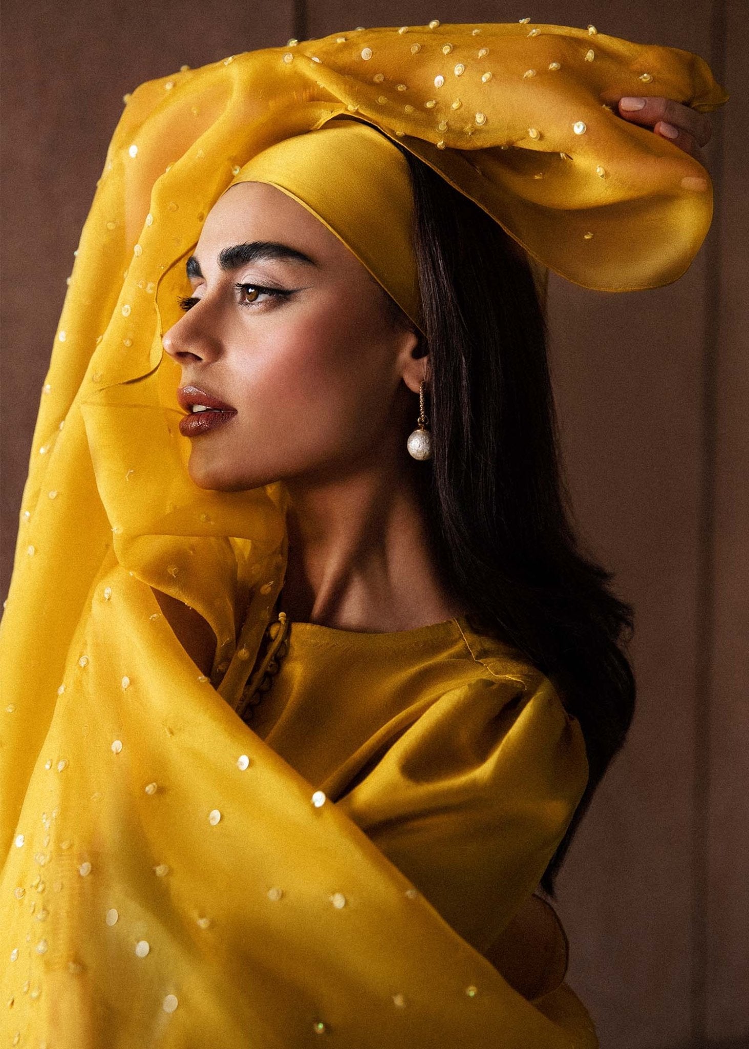 Model wearing a vibrant yellow Maize dress from Hussain Rehar's Luxury Pret Eid '24 collection. Pakistani clothes online in UK.