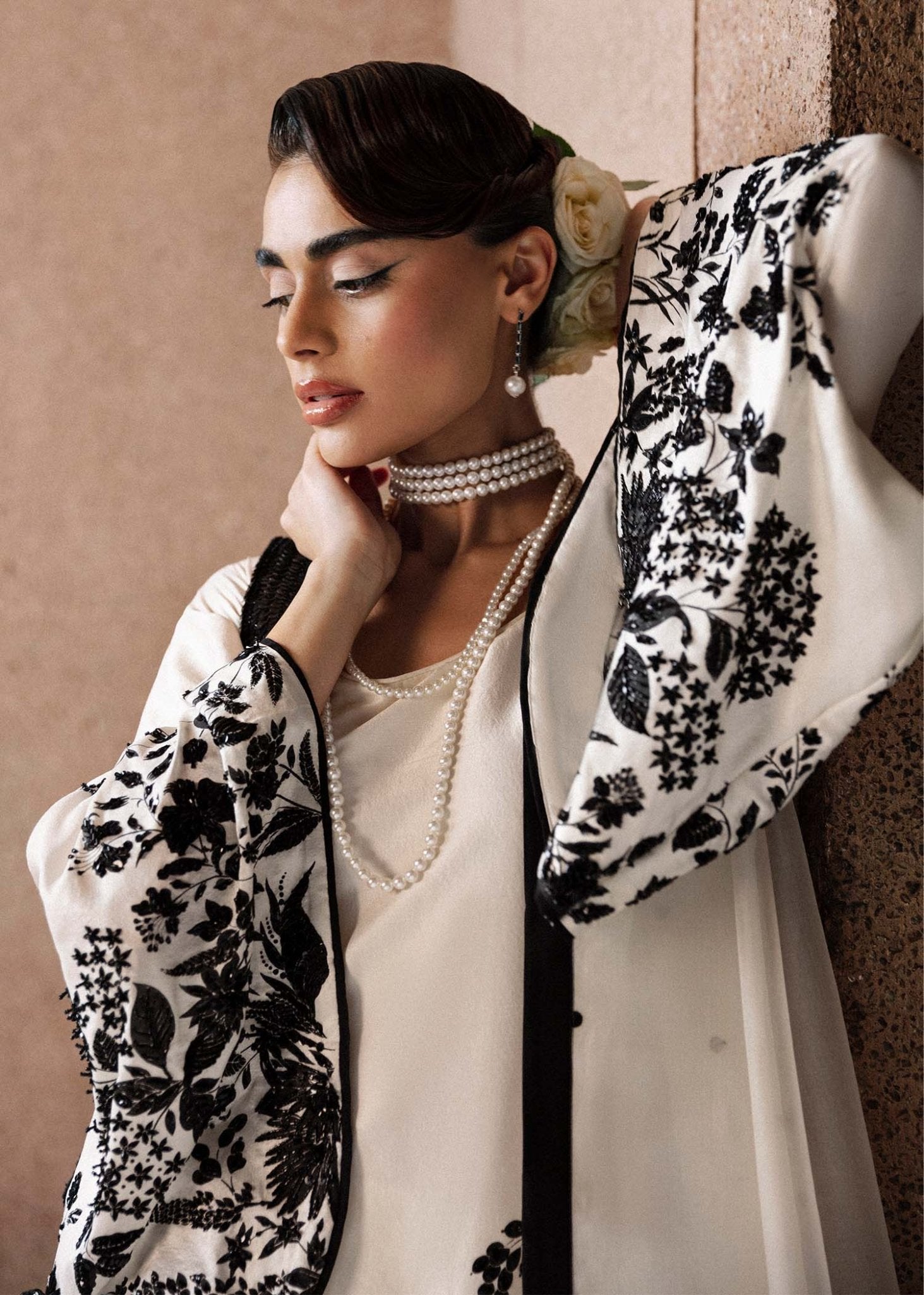 Model wearing a black and white Tusk dress from Hussain Rehar's Luxury Pret Eid '24 collection. Pakistani clothes online in UK.