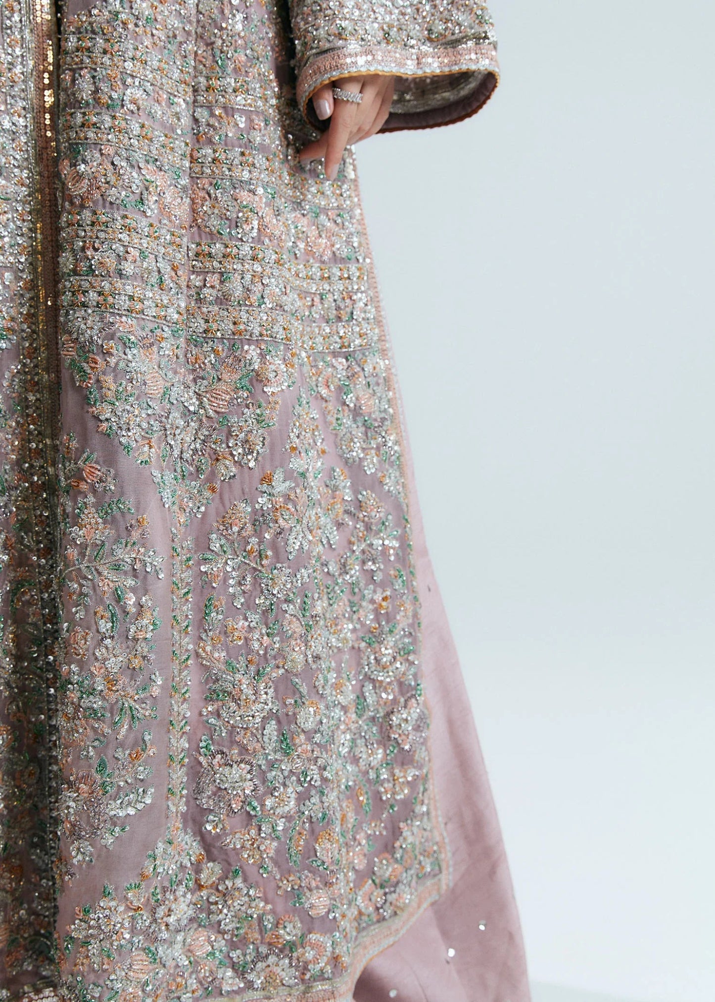 Model wearing a pastel pink Rosabelle dress from Hussain Rehar's Sitaray Formals. Ideal for weddings. Find Pakistani clothes online in UK.