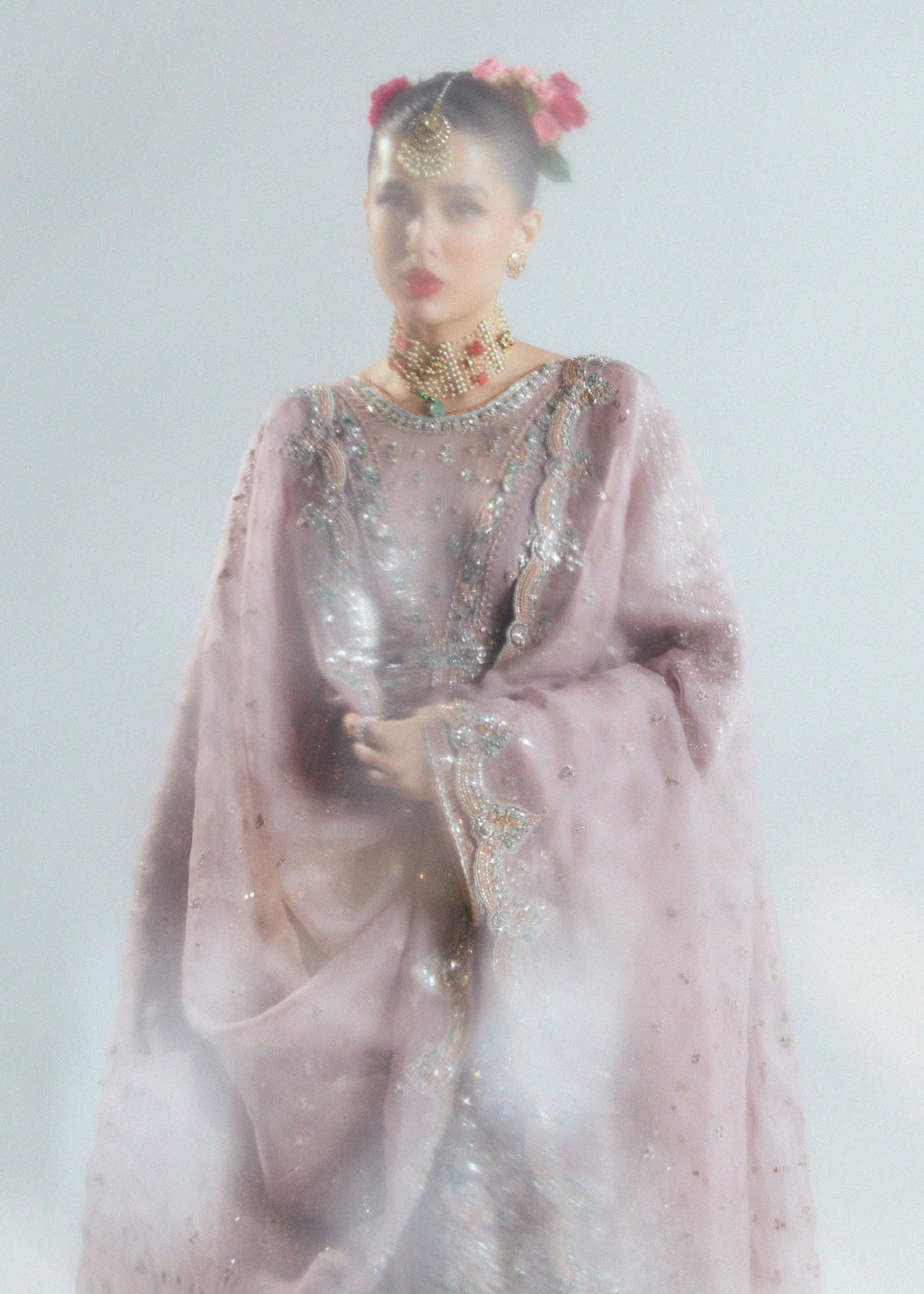 Model wearing a pastel pink Rosabelle dress from Hussain Rehar's Sitaray Formals. Ideal for weddings. Find Pakistani clothes online in UK.