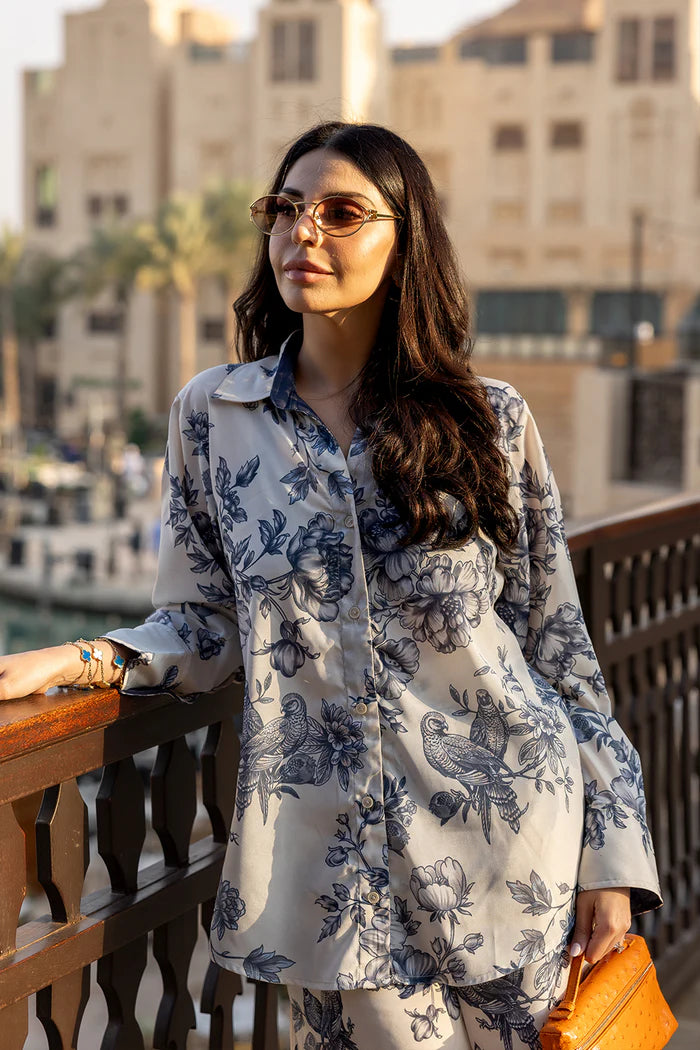 Model wearing white co-ord set with navy floral print from Saira Rizwan, Pakistani luxury pret, Pakistani clothes online in UK.
