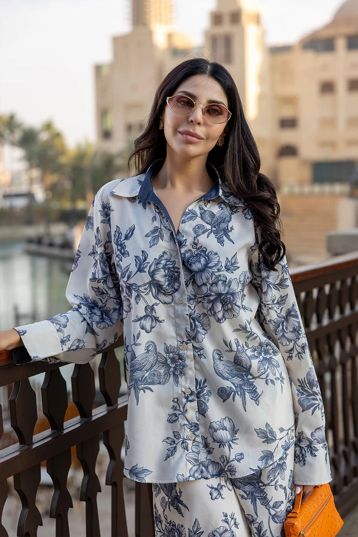 Model wearing white co-ord set with navy floral print from Saira Rizwan, Pakistani luxury pret, Pakistani clothes online in UK.