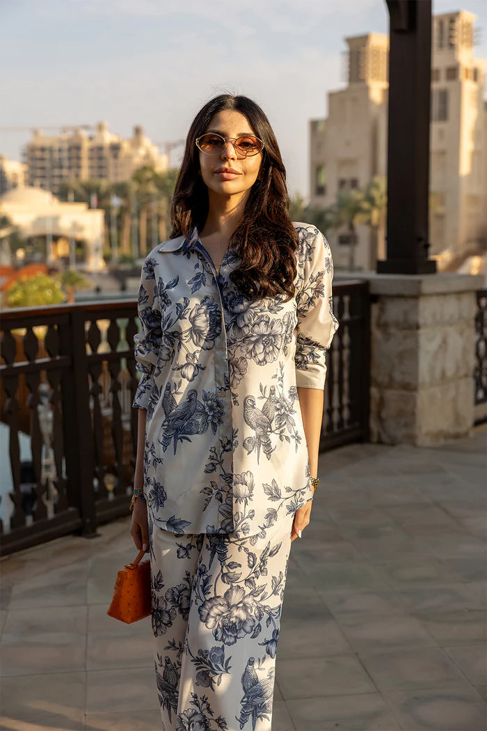 Model wearing white co-ord set with navy floral print from Saira Rizwan, Pakistani luxury pret, Pakistani clothes online in UK.