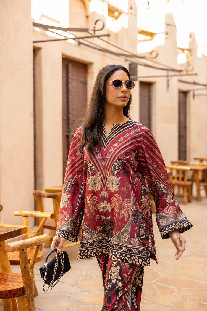 Model wearing maroon co-ord set with beige and black floral print from Saira Rizwan, Pakistani Luxury pret, Pakistani clothes online in UK.