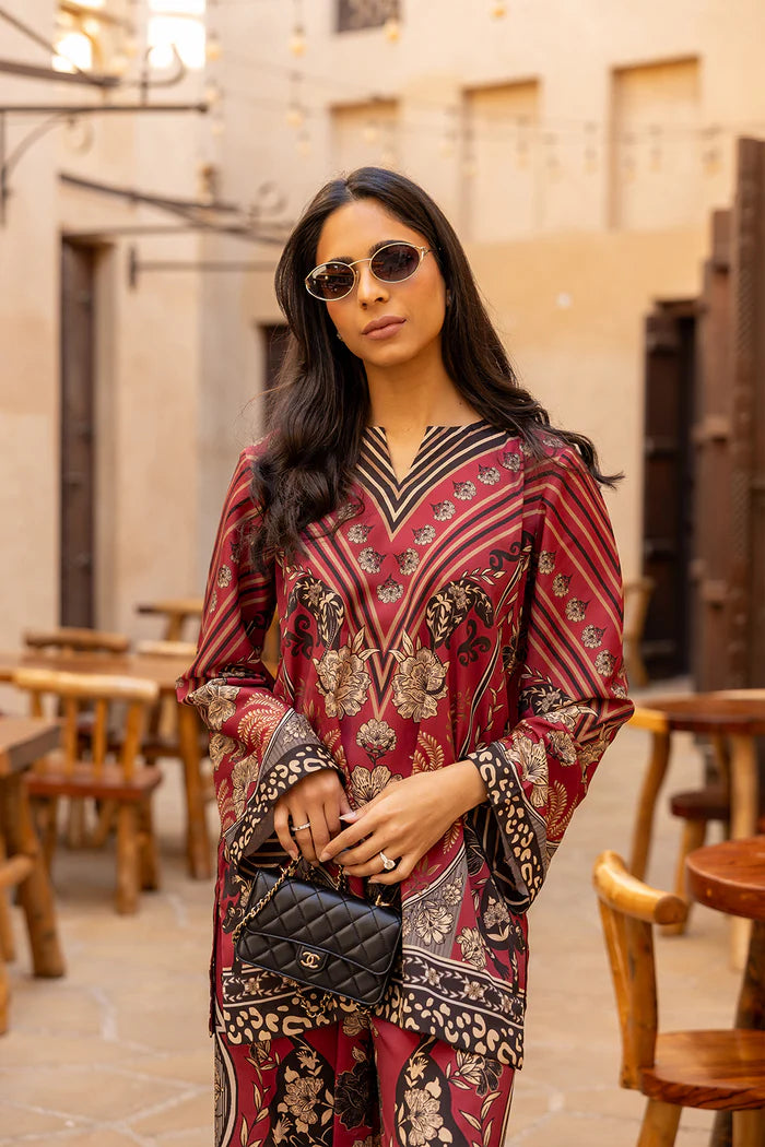 Model wearing maroon co-ord set with beige and black floral print from Saira Rizwan, Pakistani Luxury pret, Pakistani clothes online in UK.