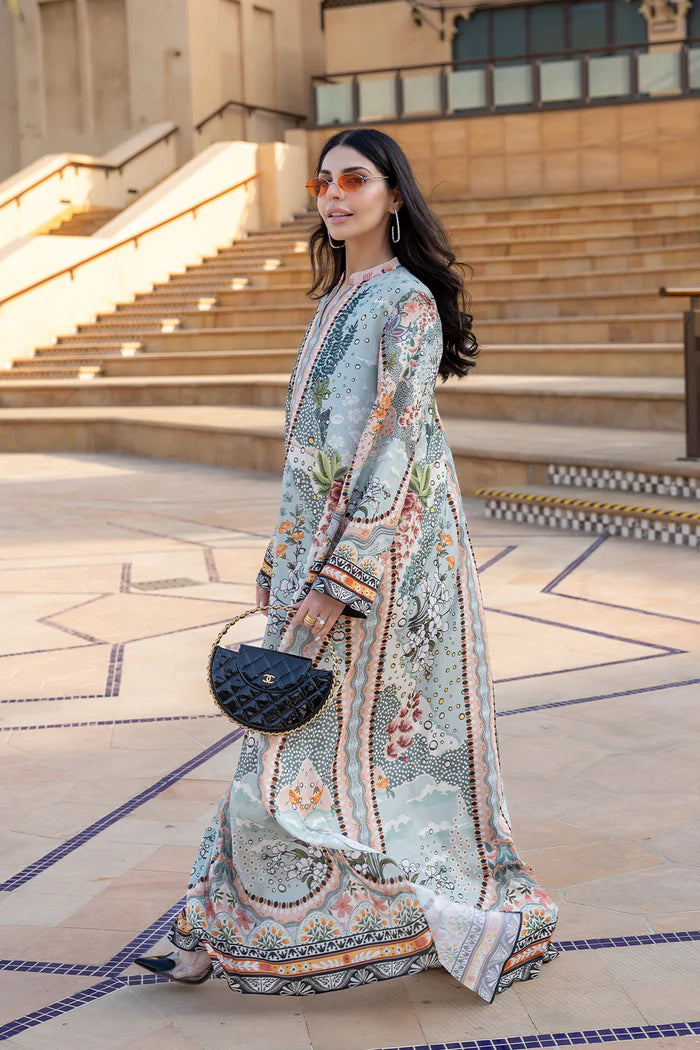 Model wearing multicolour printed long kaftan-style dress with flared sleeves from Saira Rizwan, Pakistani luxury pret, Pakistani clothes online in UK.