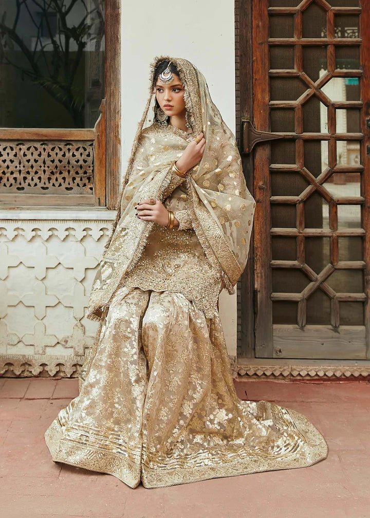 Model wearing gold Chaman dress from Kanwal Malik, Afsheen Luxury Pret 2024 collection. Pakistani clothes online in UK, wedding clothes.