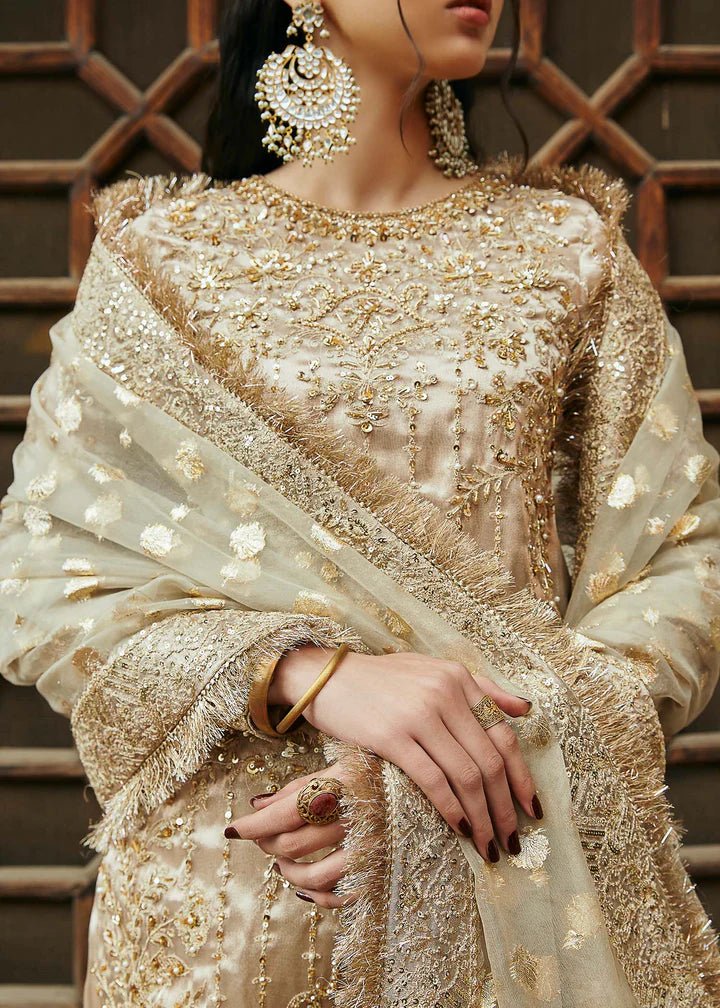Model wearing gold Chaman dress from Kanwal Malik, Afsheen Luxury Pret 2024 collection. Pakistani clothes online in UK, wedding clothes.
