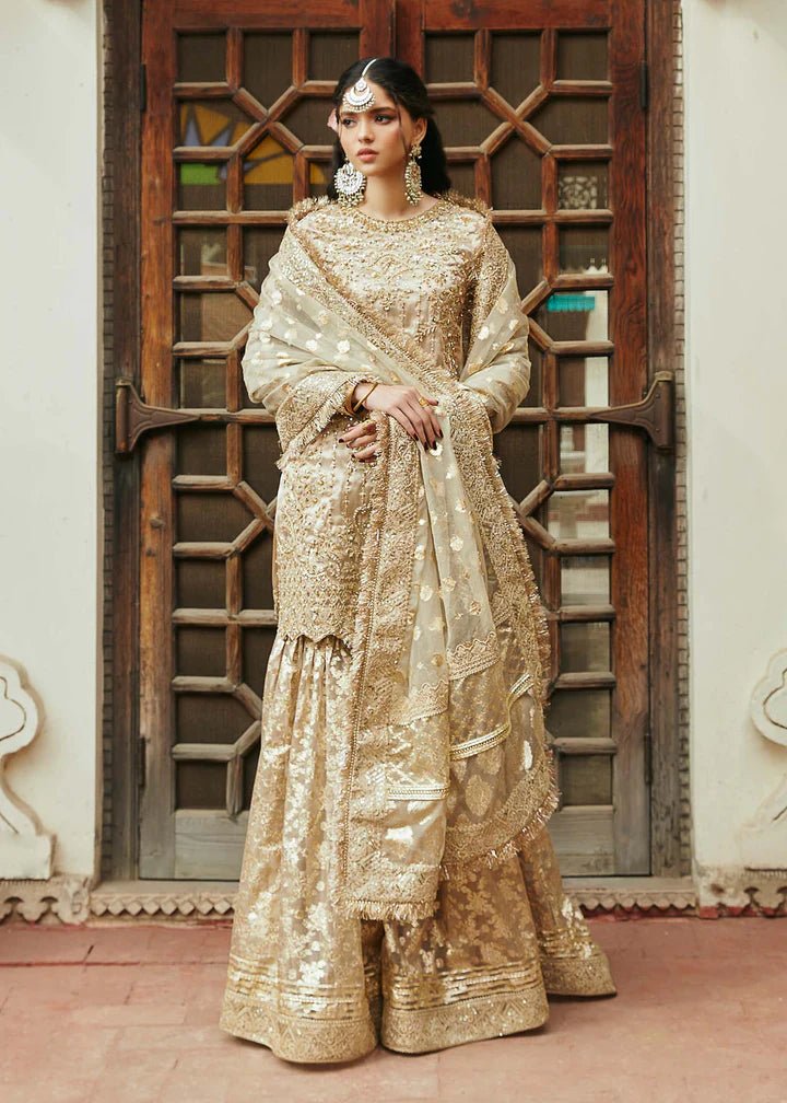 Model wearing gold Chaman dress from Kanwal Malik, Afsheen Luxury Pret 2024 collection. Pakistani clothes online in UK, wedding clothes.