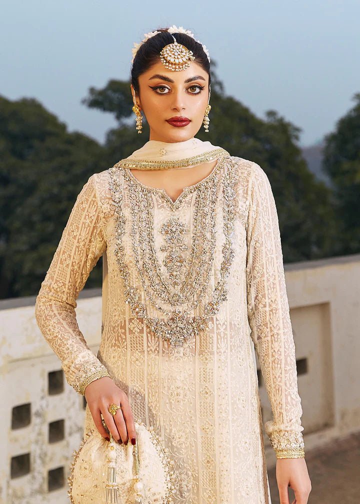 Model wearing ivory Roshan dress from Kanwal Malik, Afsheen Luxury Pret 2024 collection. Pakistani clothes online in UK, wedding clothes.