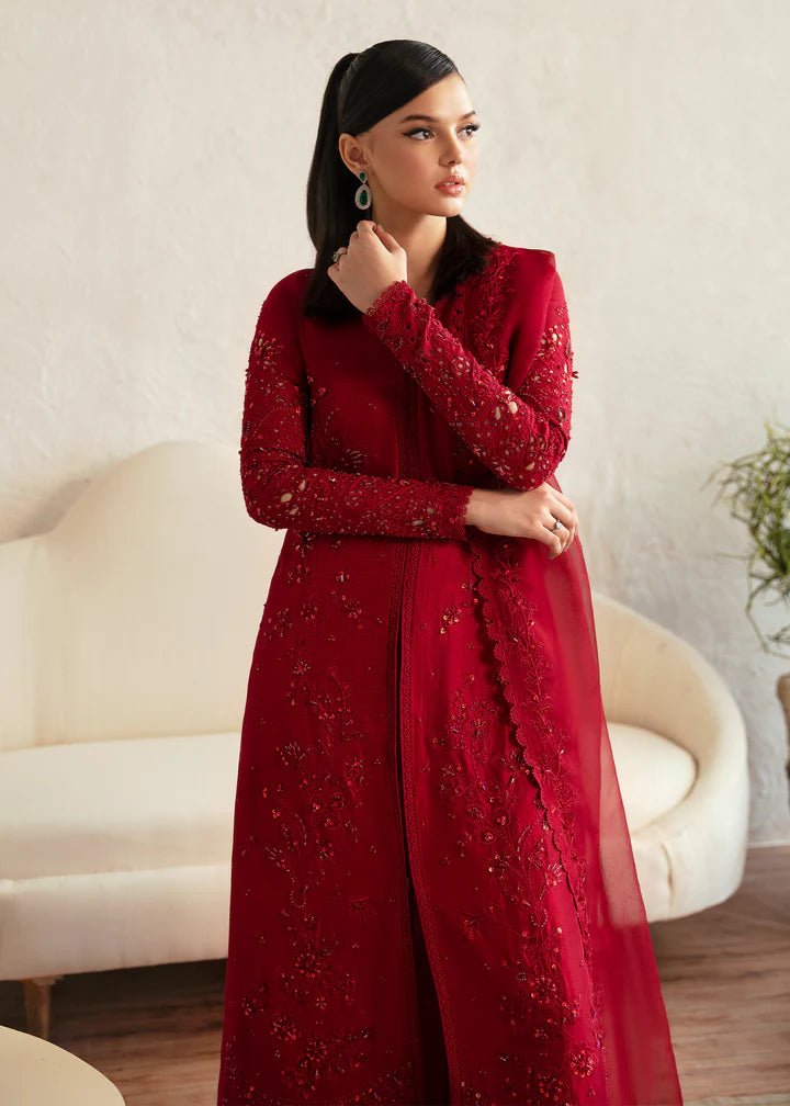 Model wearing a red Aleysa dress from Kanwal Malik. Elegant Pakistani wedding clothes available online in the UK. Perfect for luxury events and celebrations.