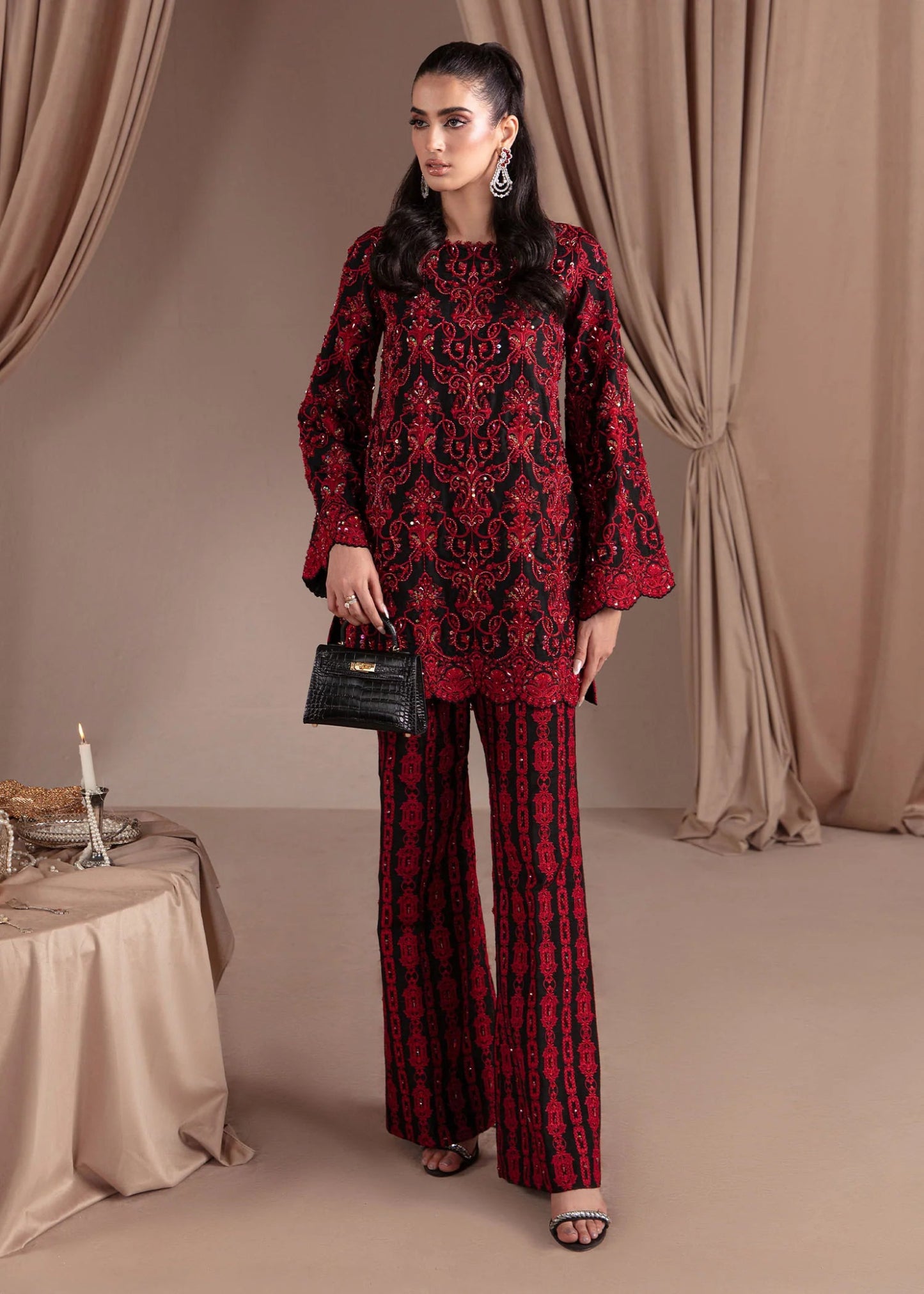 Model wearing Kanwal Malik Elara Luxury Pret '24 Allure dress in black and red, showcasing Pakistani wedding clothes online in the UK.