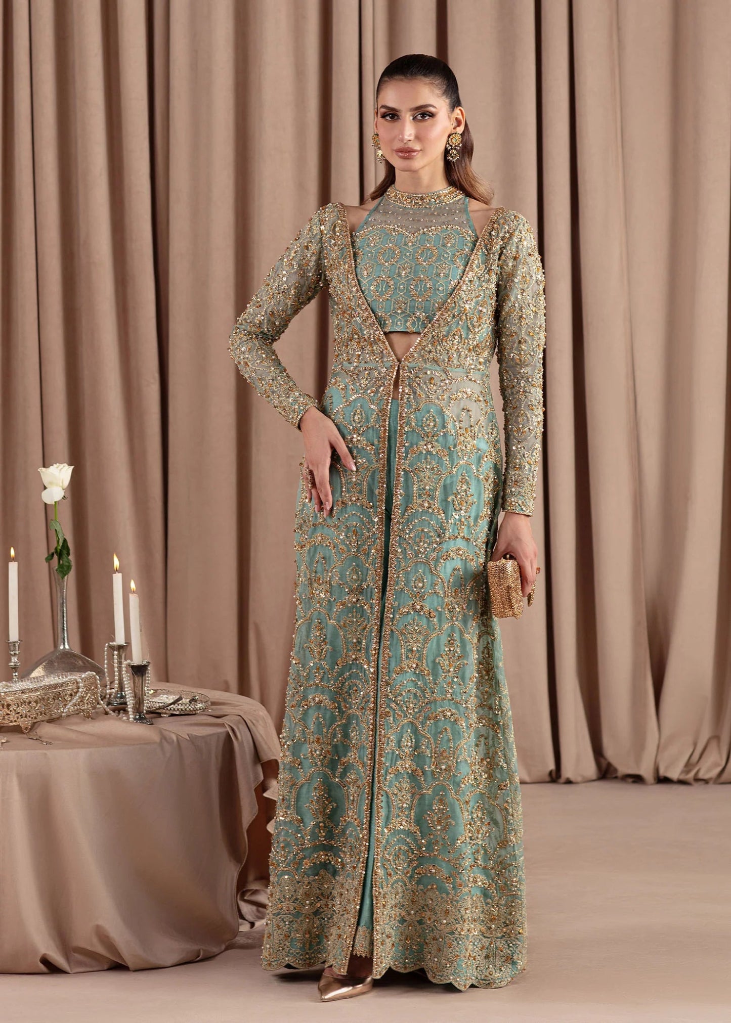 Model wearing Kanwal Malik Elara Luxury Pret '24 Aquamarine dress in teal, showcasing Pakistani wedding clothes online in the UK.