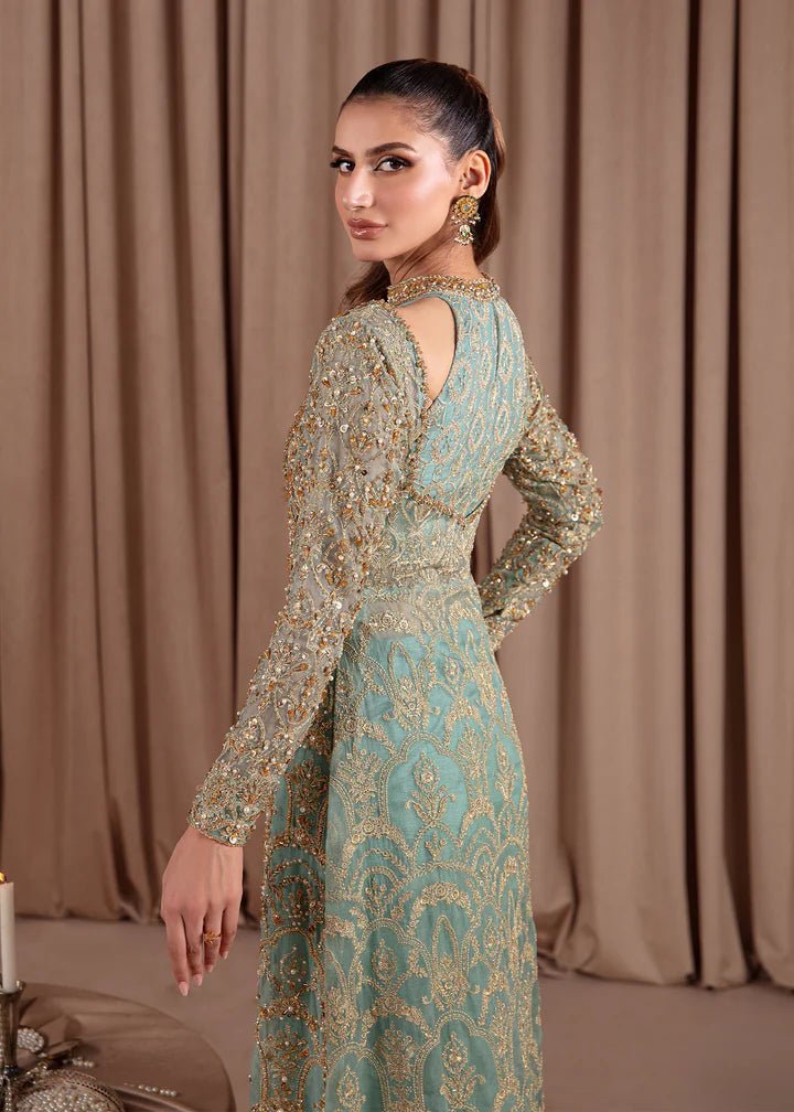 Model wearing Kanwal Malik Elara Luxury Pret '24 Aquamarine dress in teal, showcasing Pakistani wedding clothes online in the UK.