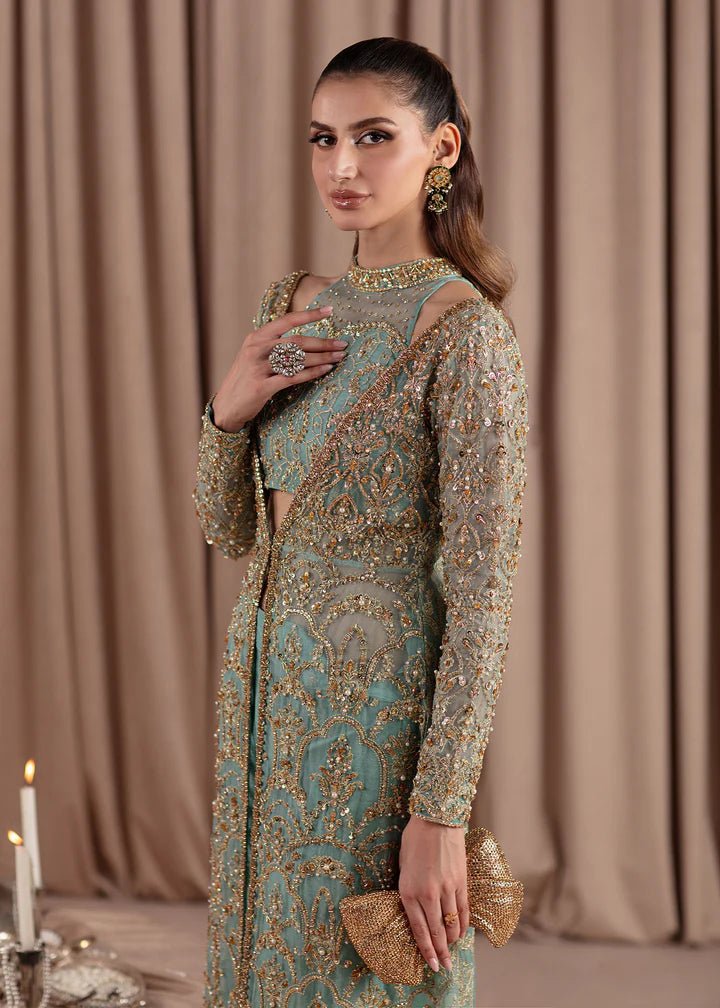 Model wearing Kanwal Malik Elara Luxury Pret '24 Aquamarine dress in teal, showcasing Pakistani wedding clothes online in the UK.