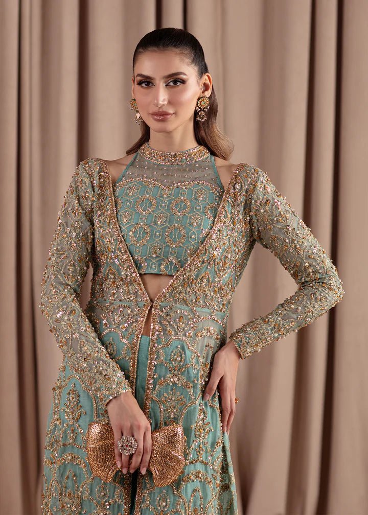 Model wearing Kanwal Malik Elara Luxury Pret '24 Aquamarine dress in teal, showcasing Pakistani wedding clothes online in the UK.
