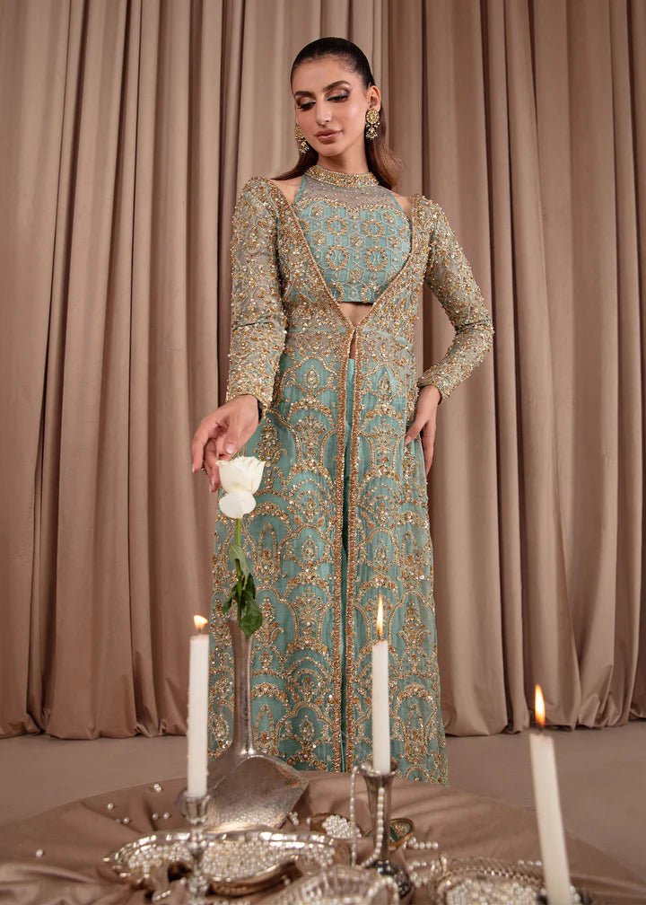 Model wearing Kanwal Malik Elara Luxury Pret '24 Aquamarine dress in teal, showcasing Pakistani wedding clothes online in the UK.