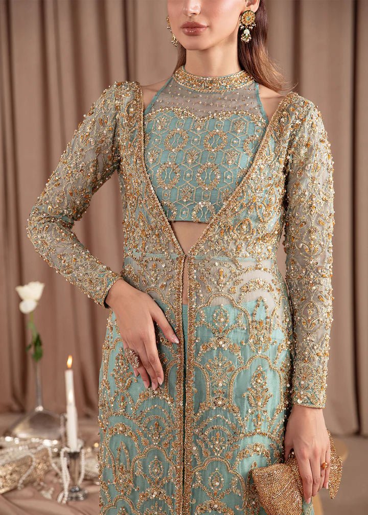 Model wearing Kanwal Malik Elara Luxury Pret '24 Aquamarine dress in teal, showcasing Pakistani wedding clothes online in the UK.